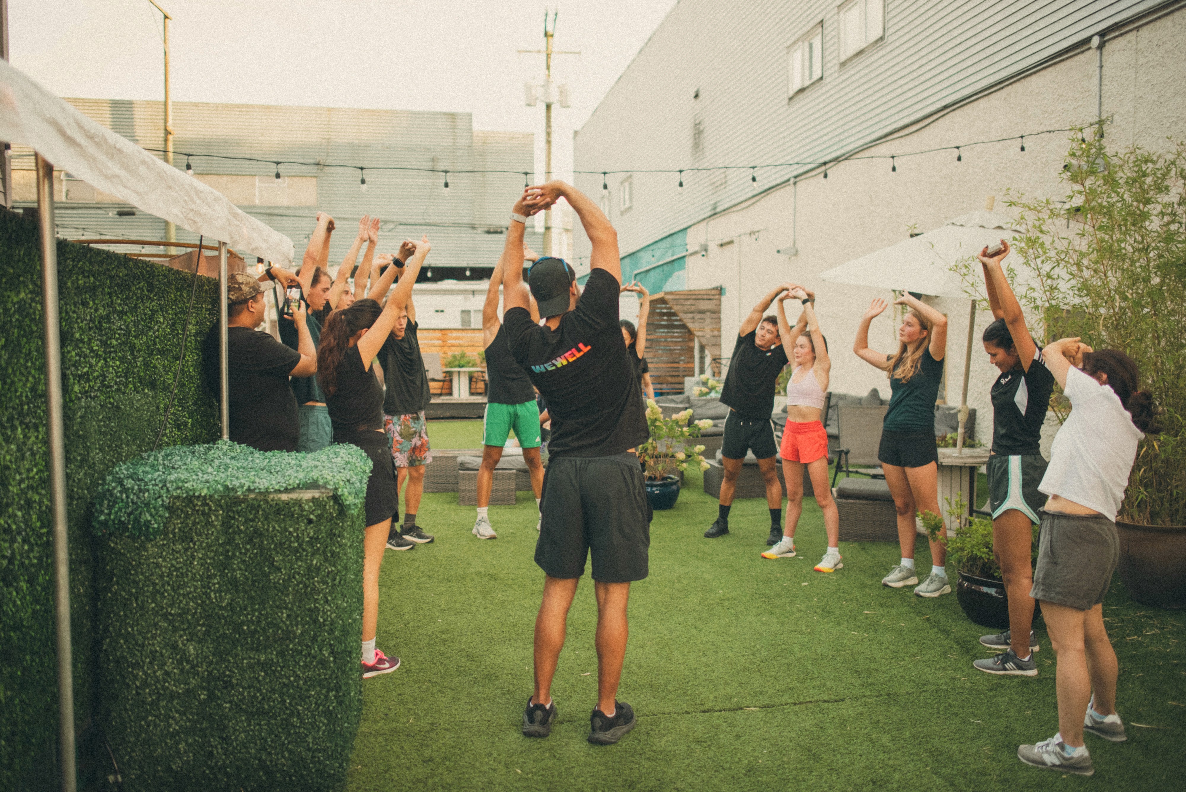 Black and white motion-blur photograph of a male sprinter in sunglasses and athletic gear mid-stride, with the bold text "pyra." overlaid across the center.