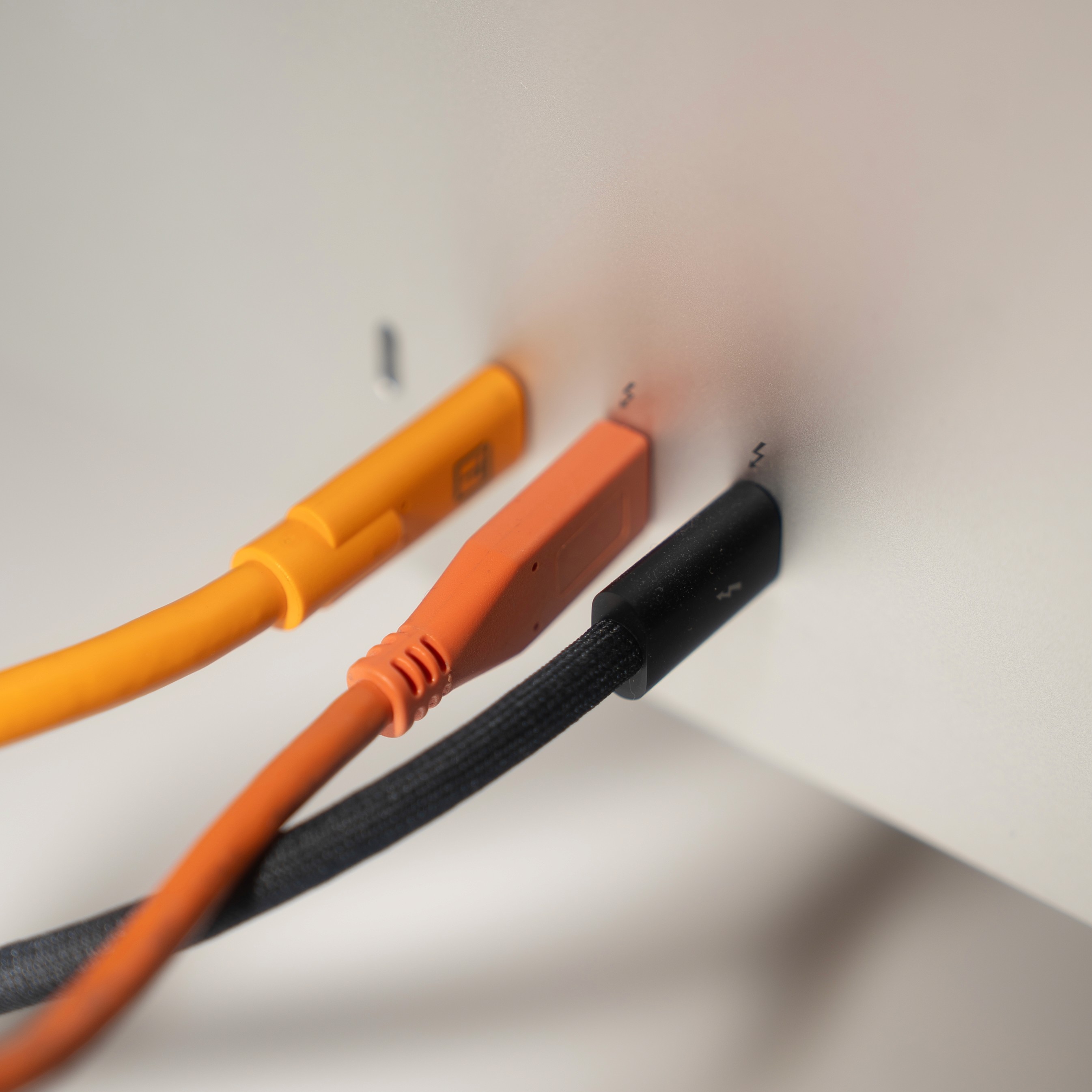 Hands working on a device or document, representing professional results delivered to clients.