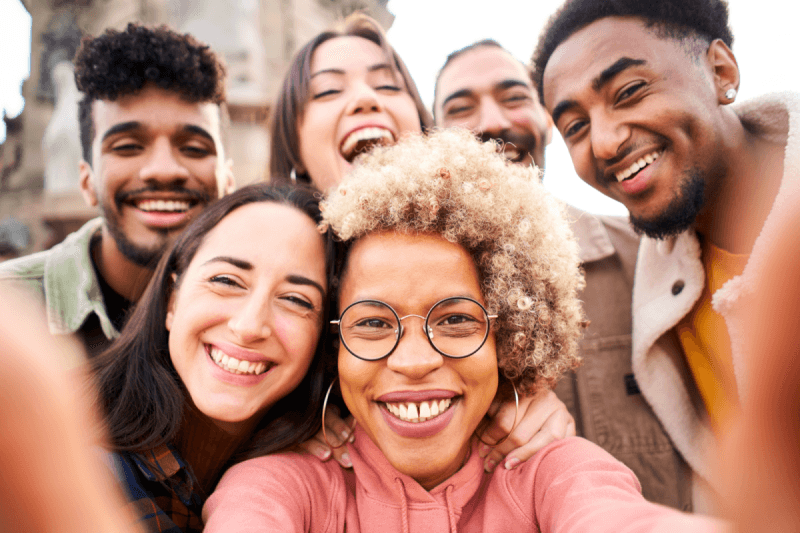 a group of people taking a selfie