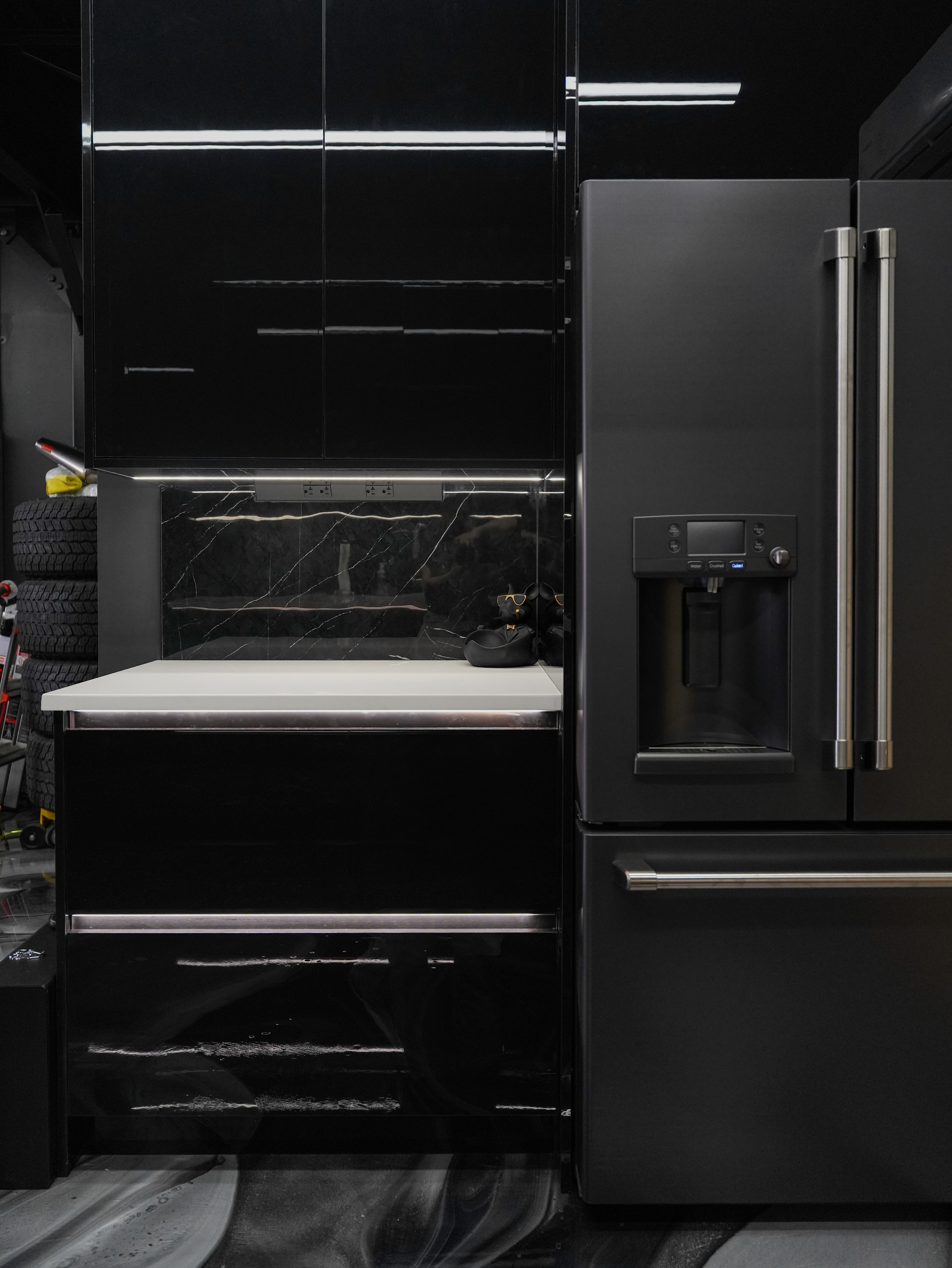 Europrean high gloss cabinets wth GE CAFE refrigerator