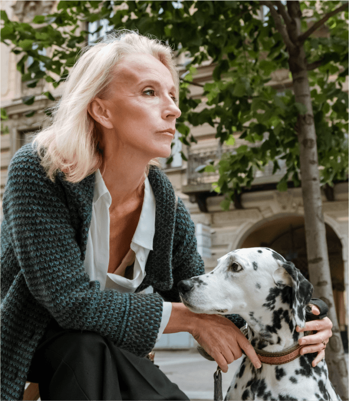 Woman posing with her dalmatian