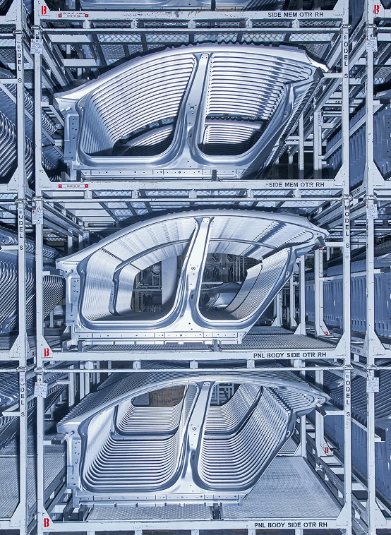 Wind turbine towering over agricultural fields