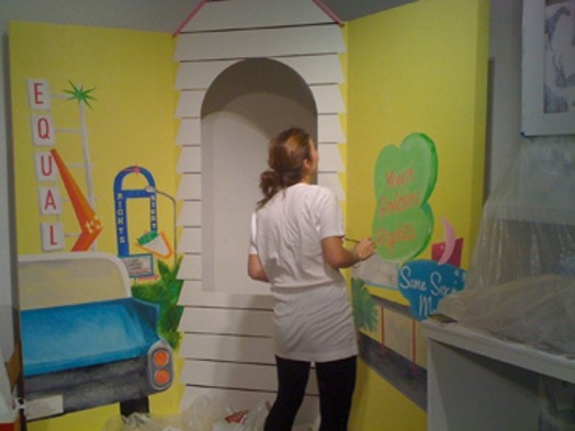 student painting installations for The Candy Coated Carnival of Controversy