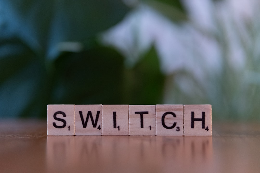 A wooden block spelling switch on a table