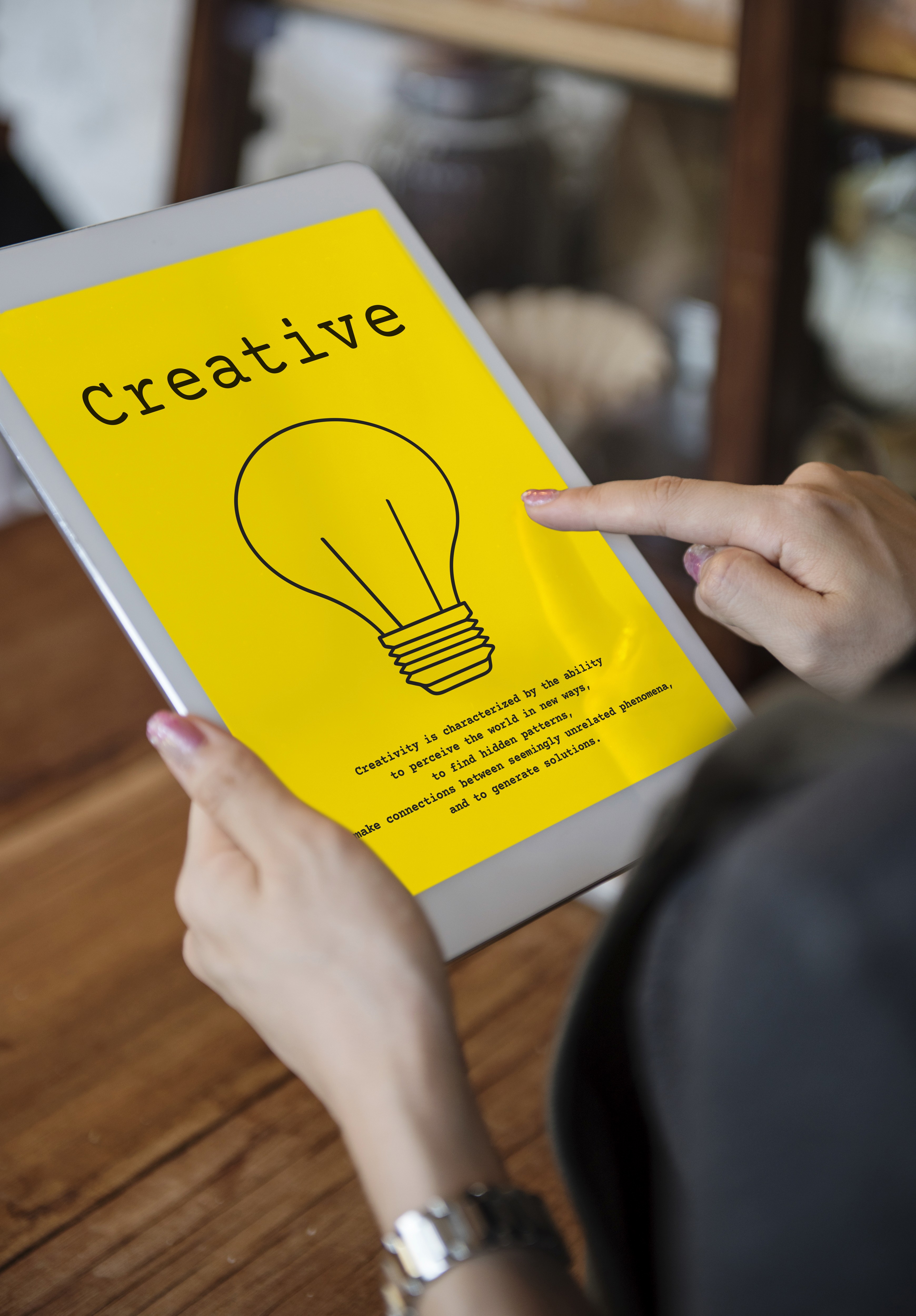 Bulb with Creative and a finger pointing it out