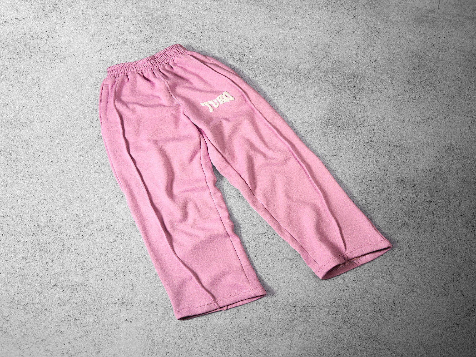 Tuko Clothing pink Dandadan inspired joggers photographer by Matthew Brown (London product photographer).