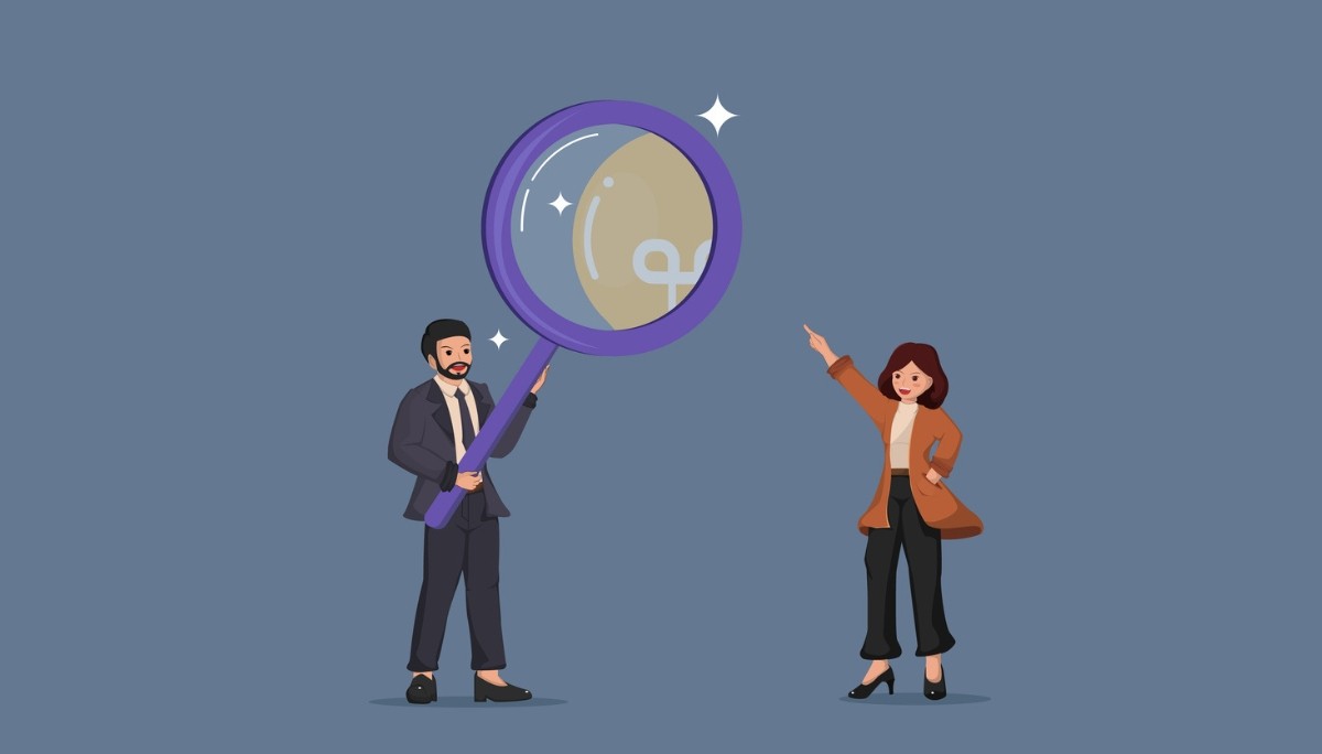 Illustration of two professionals standing beside an oversized magnifying glass, one pointing upward and the other holding the magnifier, symbolizing the search for hidden opportunities and high‑impact roles within stealth startups.