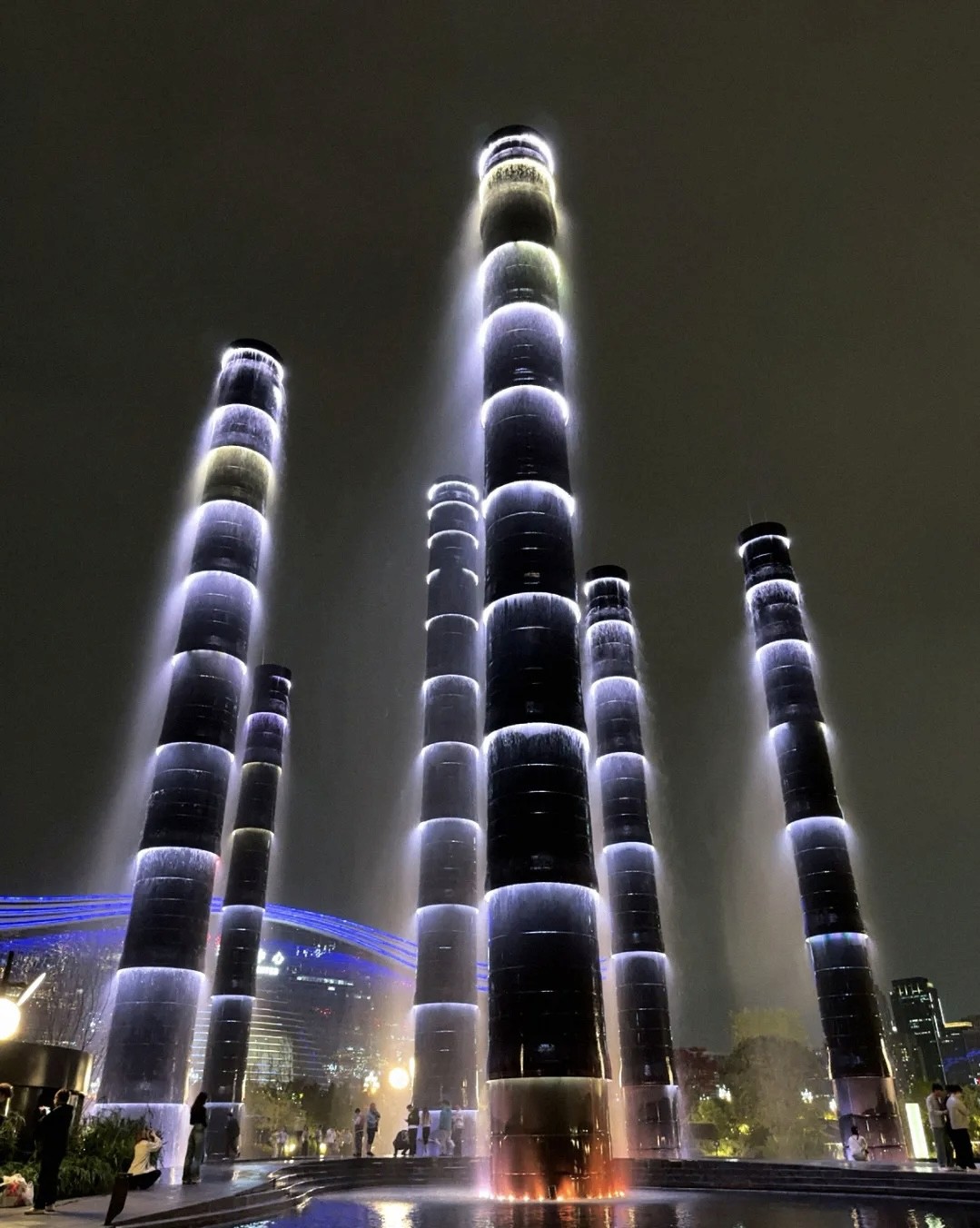 Dark cylindrical Vitality Tower fountain landmark of Chengdu SKP