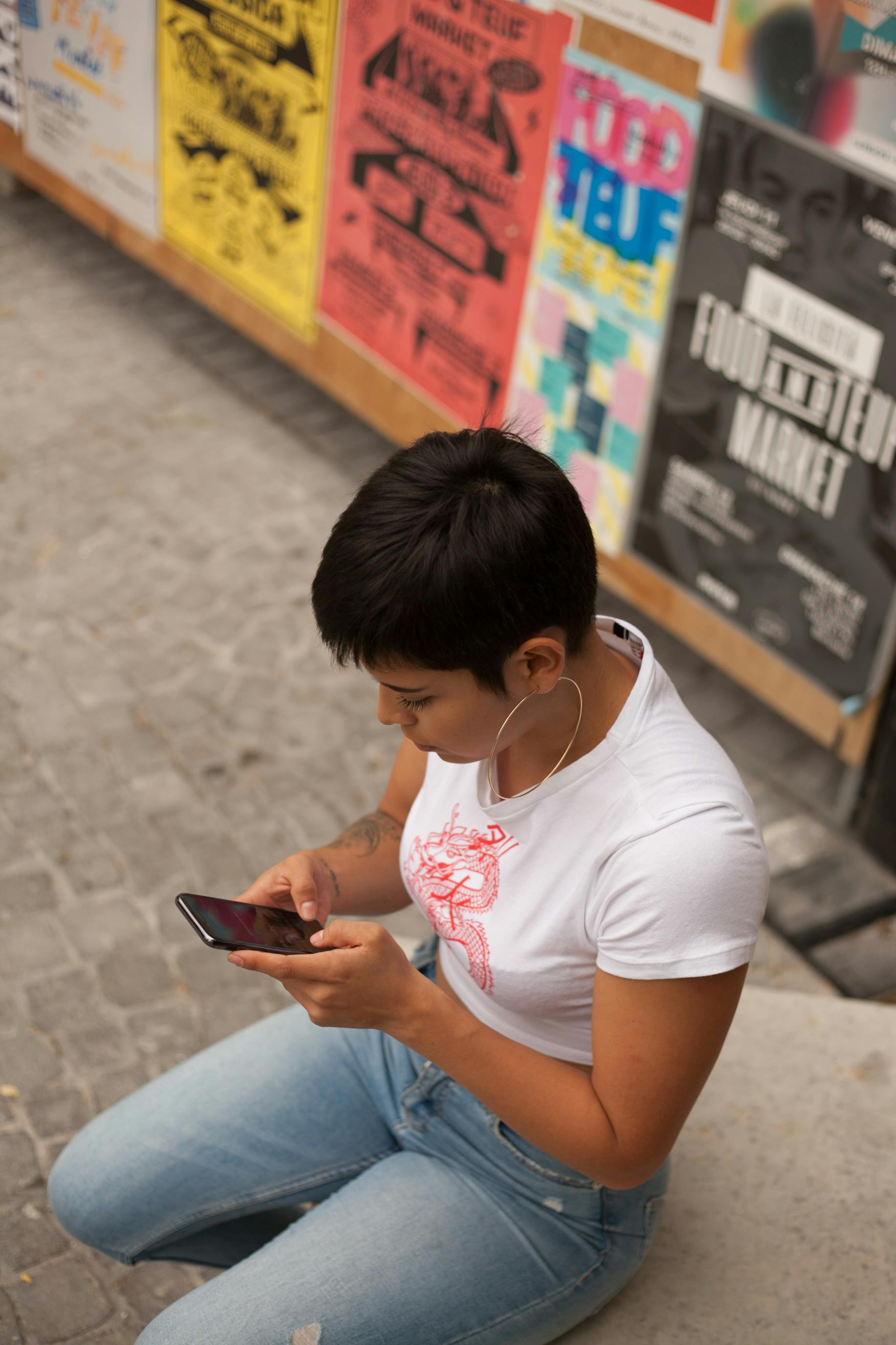 Person checking phone feeling uncertain about relationship and online dating activity