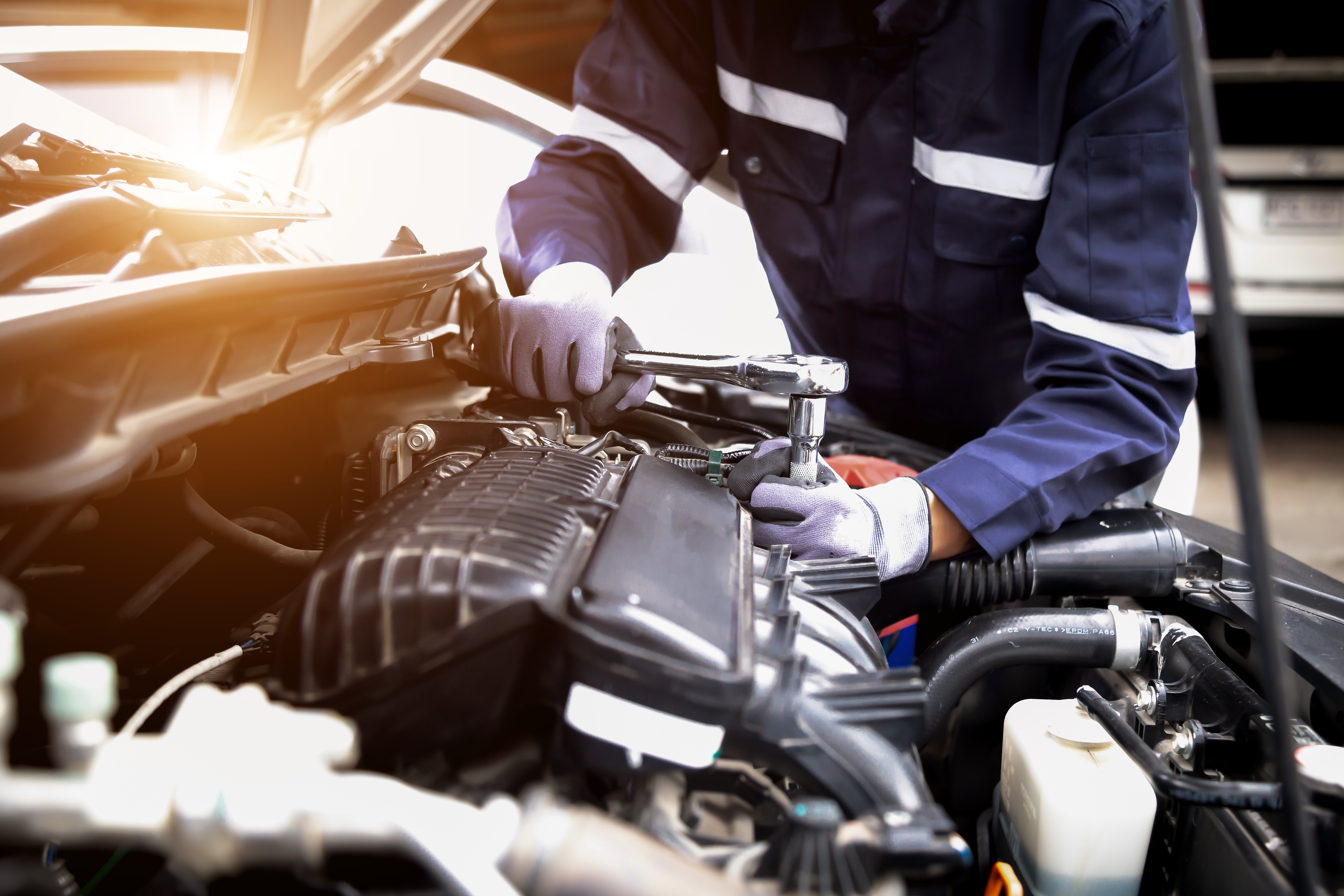A technician working on a car