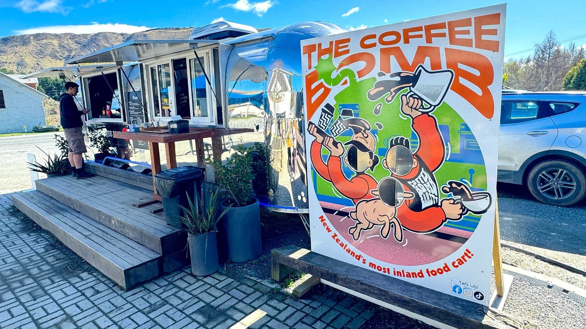 The Coffee Bomb Face cutout Standee Picture wide view with the shop