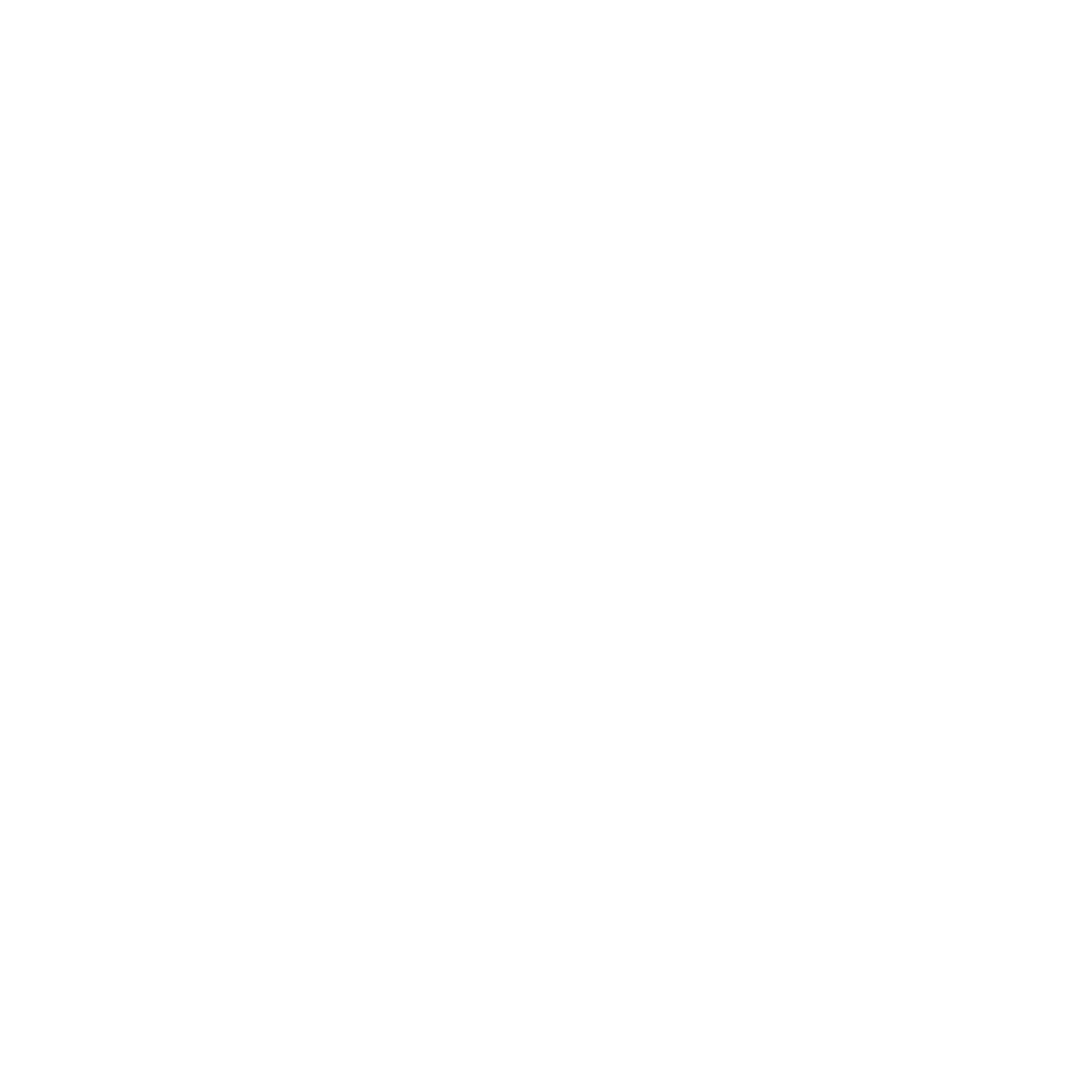 A man in a blue suit and shirt stands confidently in a modern kitchen. Warm lighting creates a relaxed atmosphere. His expression is serene.