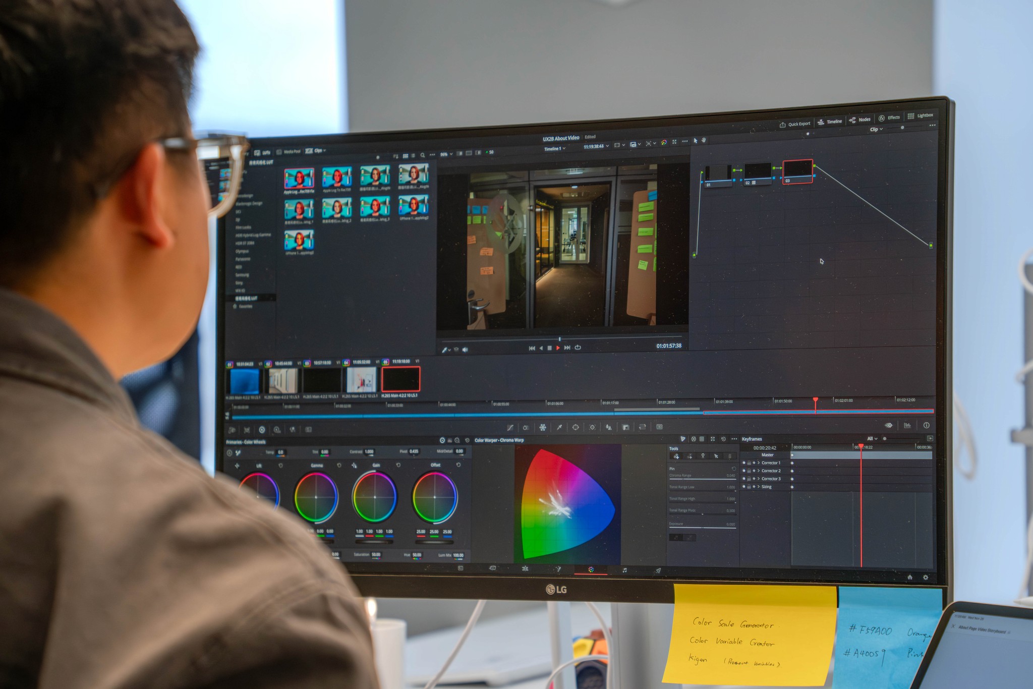 man in black jacket holding blue and white plastic cup