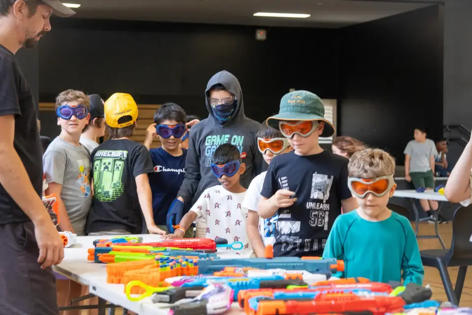 Children playing in a gel blaster activity