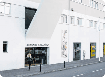 White exterior and street-level entrance of Reykjavík Art Museum.