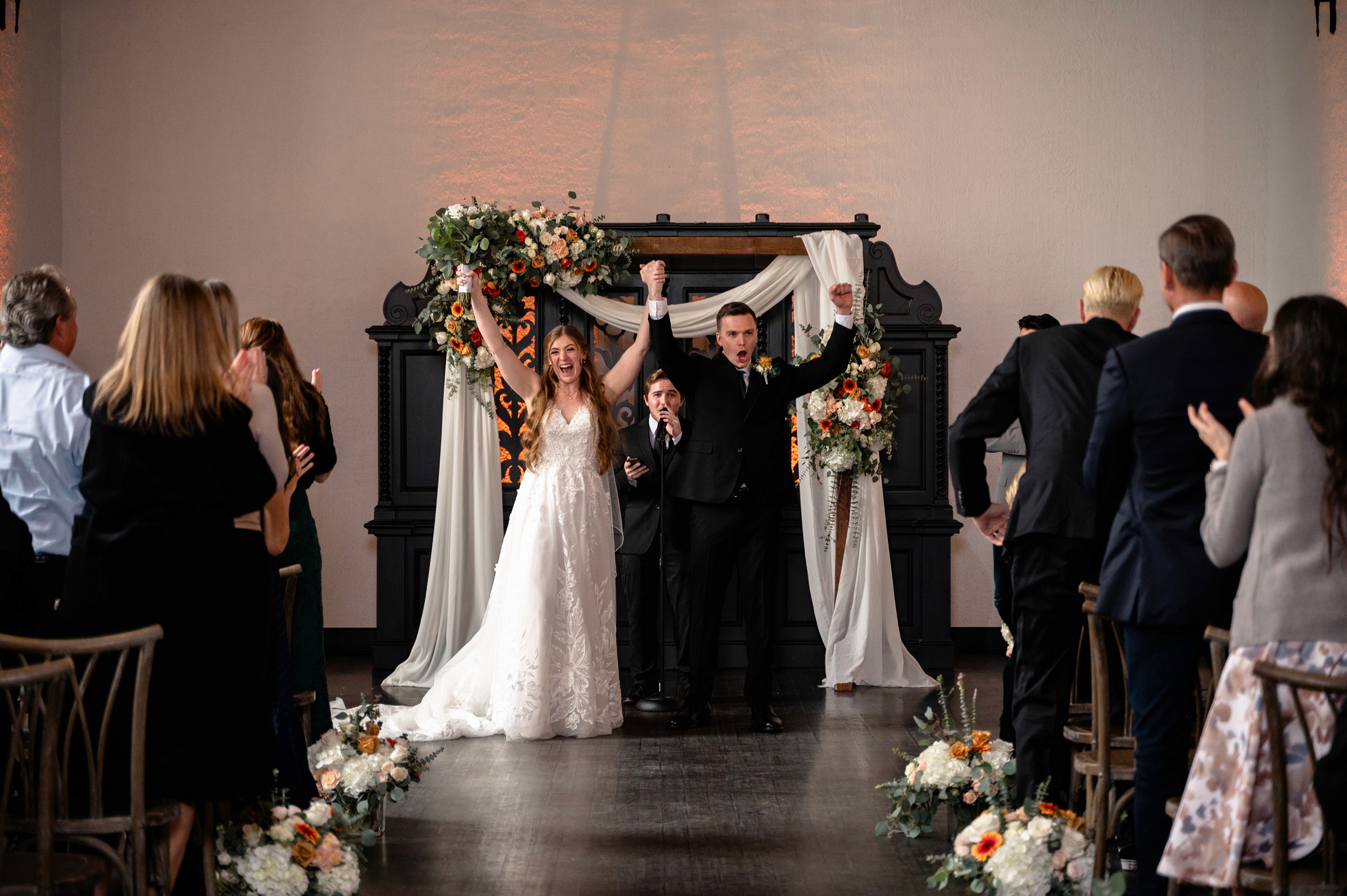 Flat lay wedding details with bouquet, rings, and sparkling bridal heels