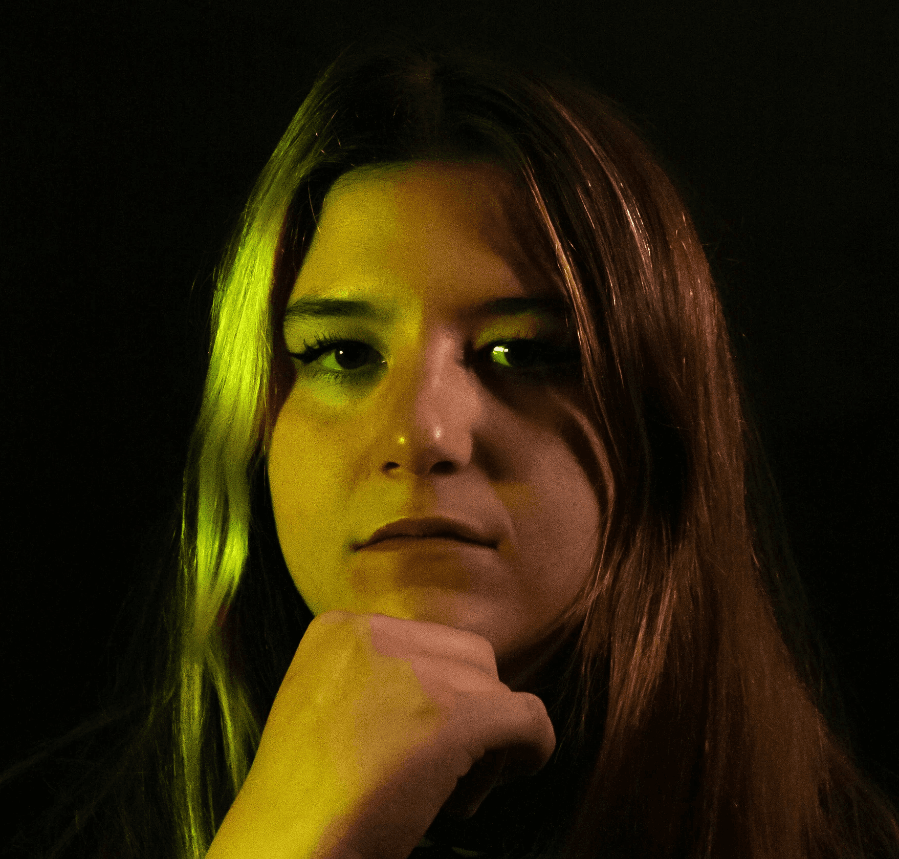 a woman with long hair and a watch on her wrist