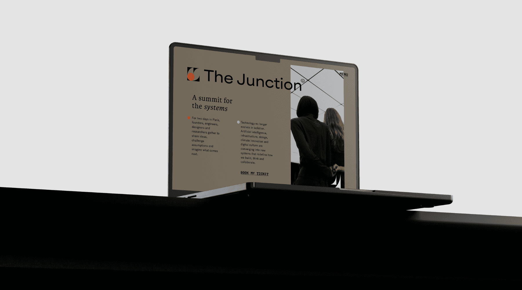 A person in business attire lies amidst scattered papers and folders on a red carpet, holding a phone receiver. The scene conveys chaos and stress.