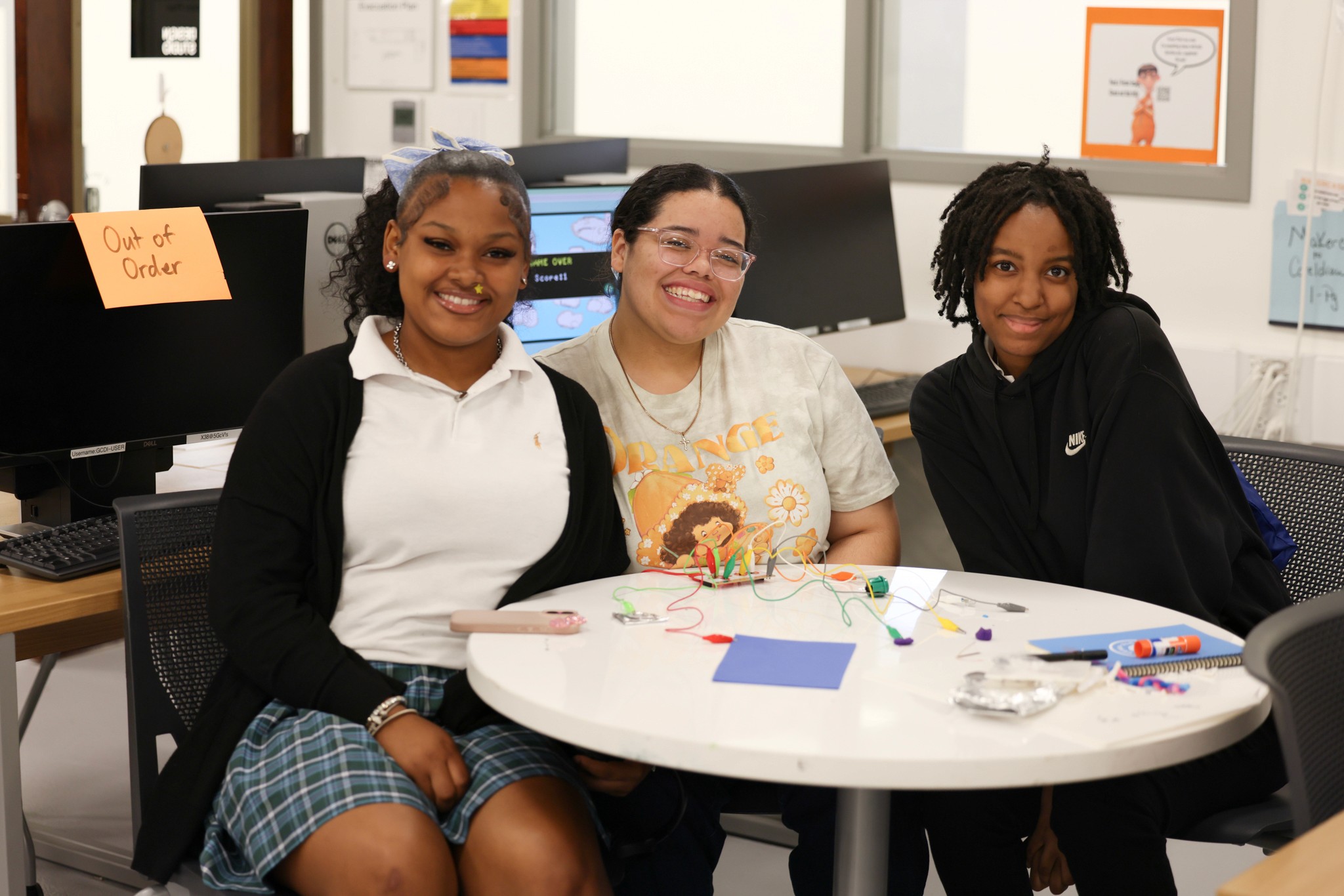 three highschool students at the beach during golden hour