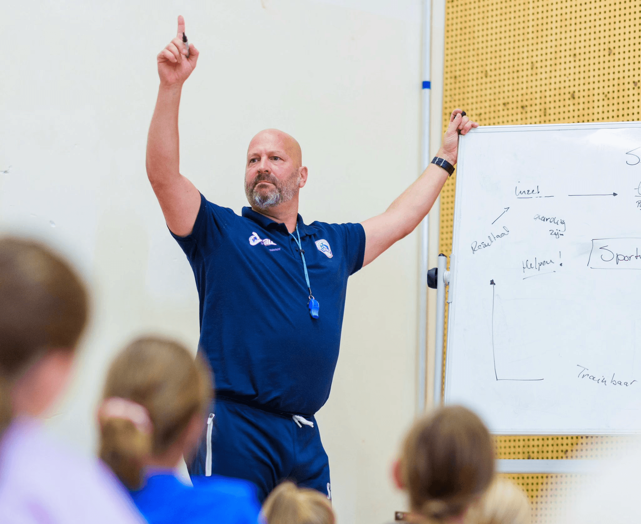 woman sitting around table holding tablet