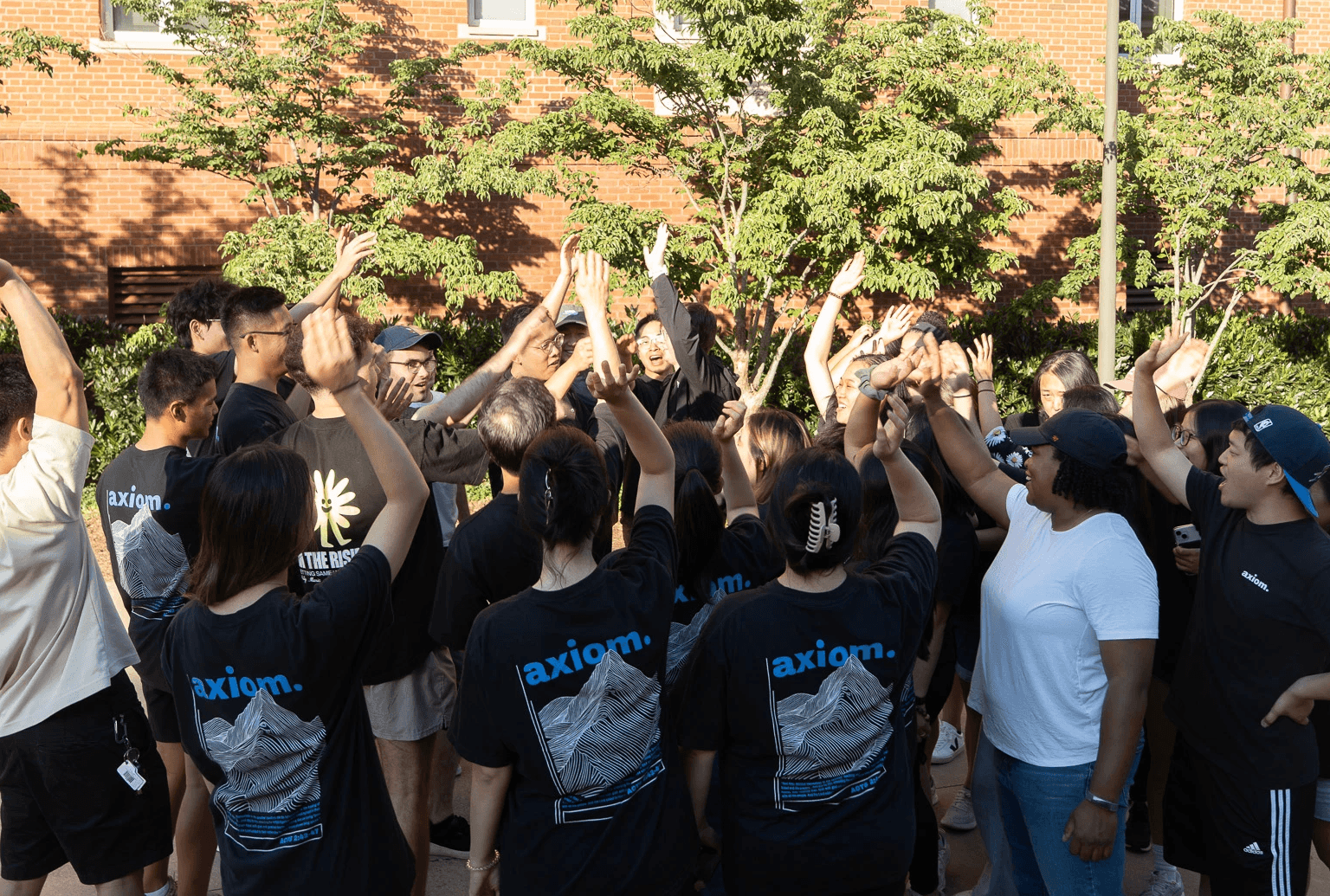 Team huddle arms in