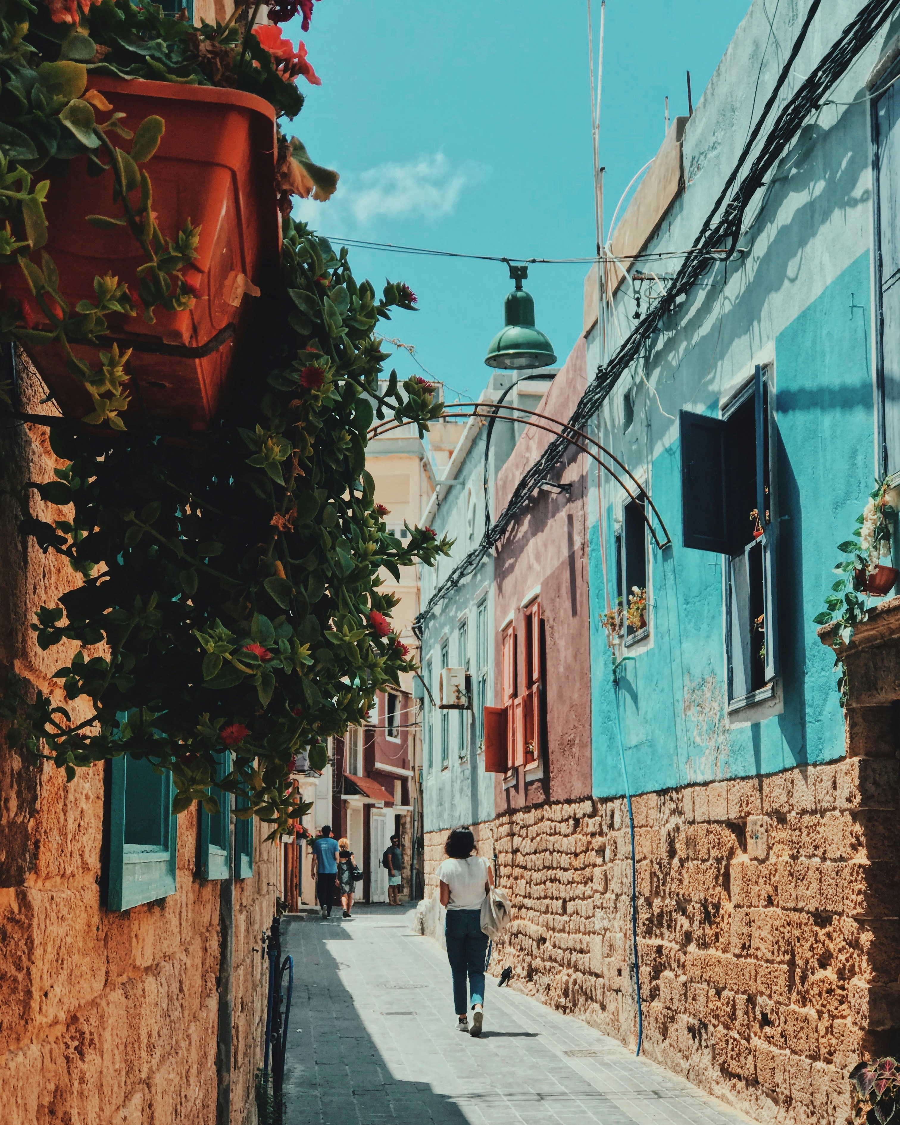 woman walking on street during daytime