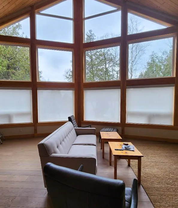 timber framed full height windows and high ceilings in haliburton great room.