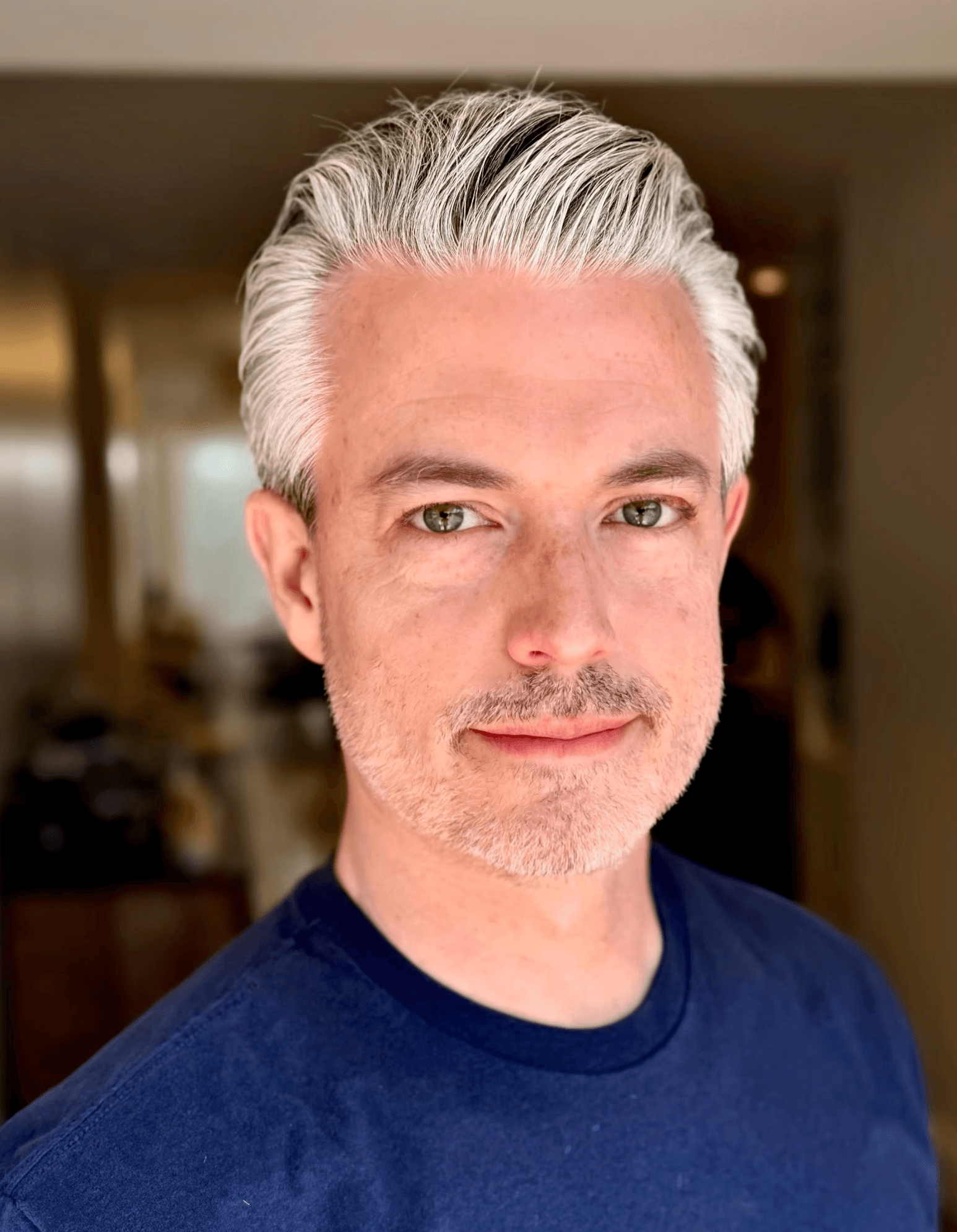 Gentleman's cut.  Salt and pepper hair.  Slick back styling.  White male.  Bomane Salon.  Courtney Palmore.  Beverly Hills Luxury Barber. Hairstylist.