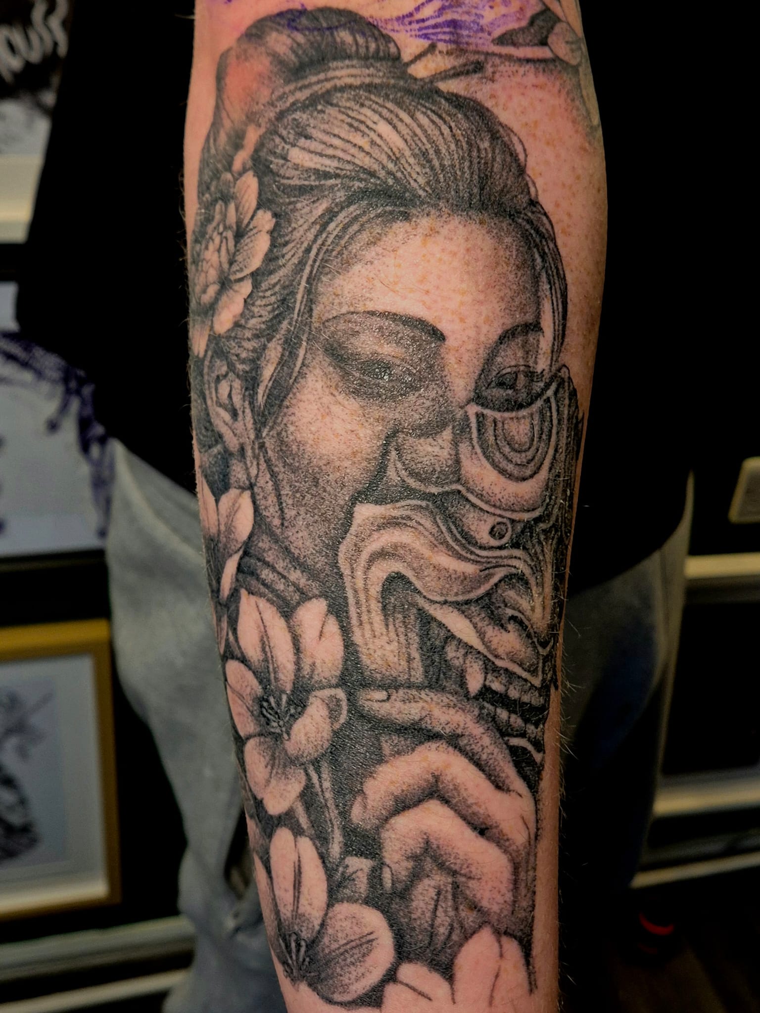 Full arm tattoo sleeve with portrait design in Hazel Grove