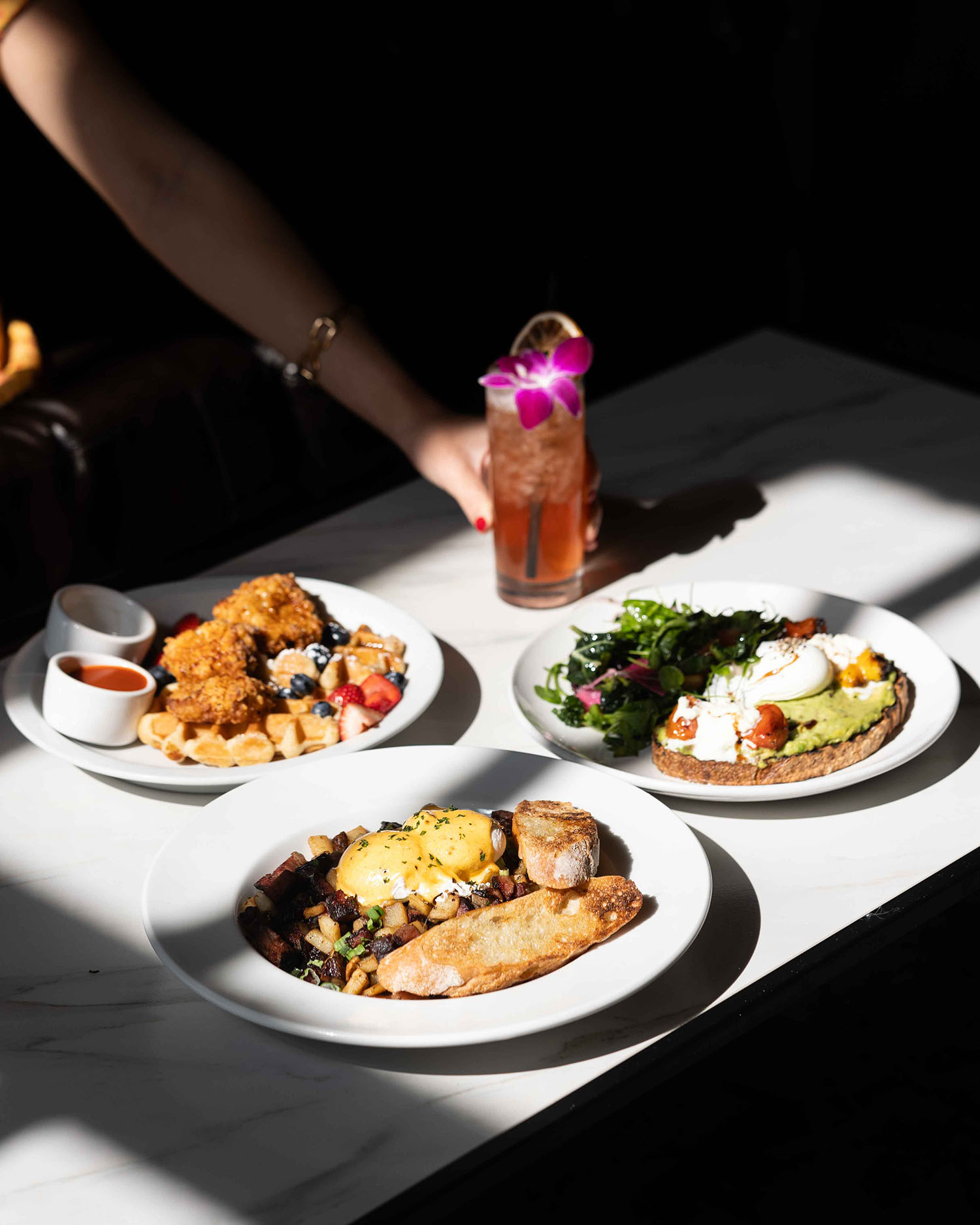 Hubbard Inn brunch spread with cocktail overhead restaurant photography Chicago River North