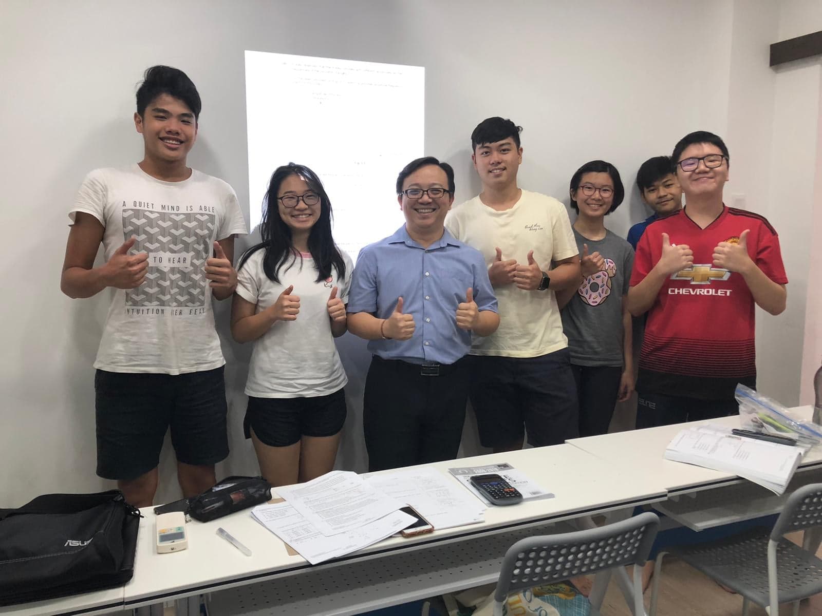 Students thumbs up at Physics Academy