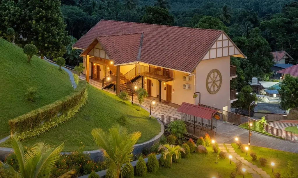 Au Revoir Wellness Resort Palakkad – Classic Room Building at Dusk, A Budget-Friendly Stay Amidst Nature