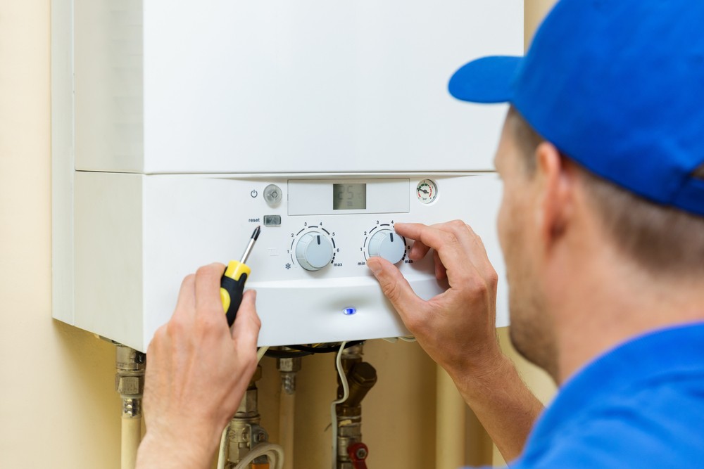 An engineer conducting a boiler installation service