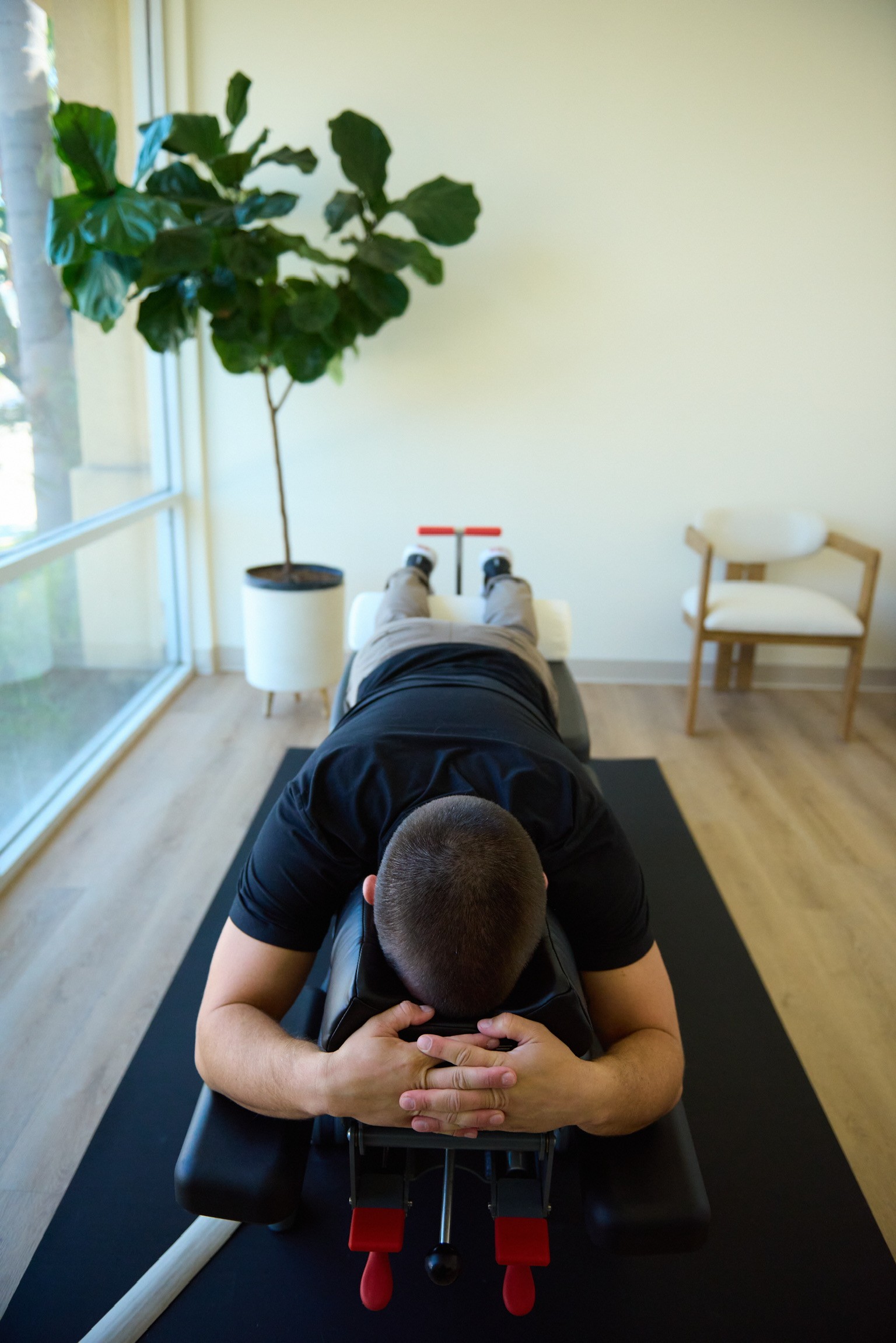 Black cosmetic product bottle against a dark background