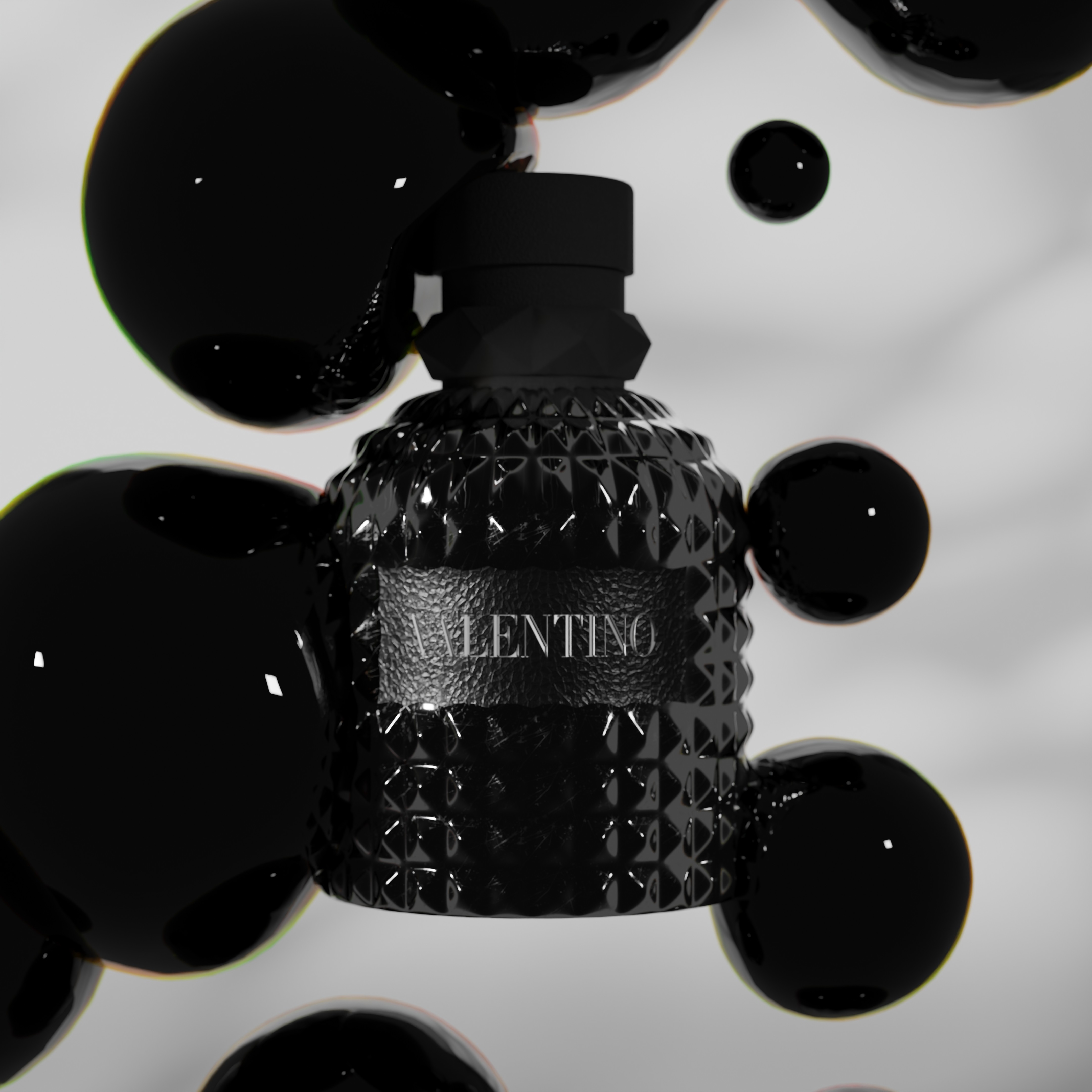 A black valentino perfum with black bubbles on it