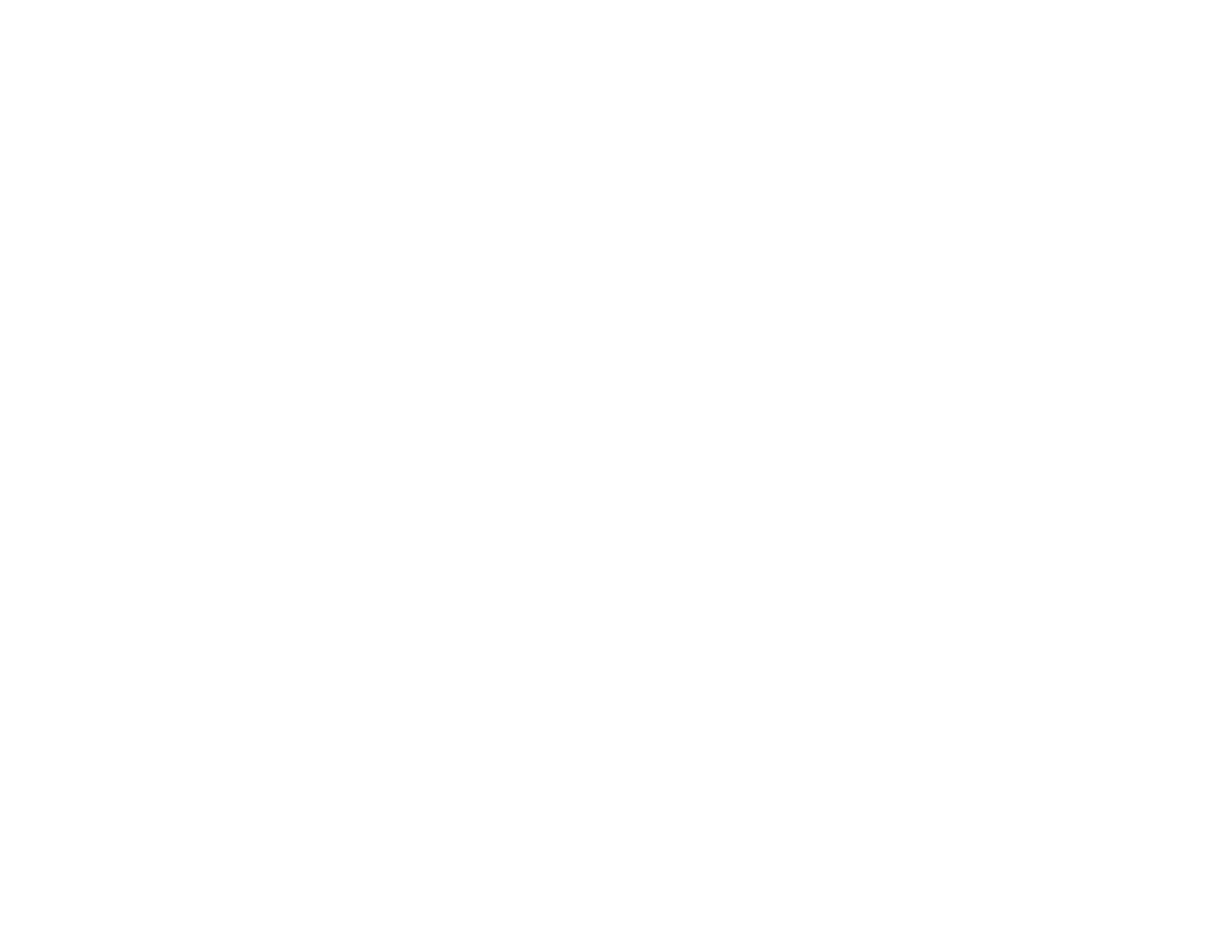 A close-up of a person wearing green-tinted glasses, with a serious expression and smooth skin.