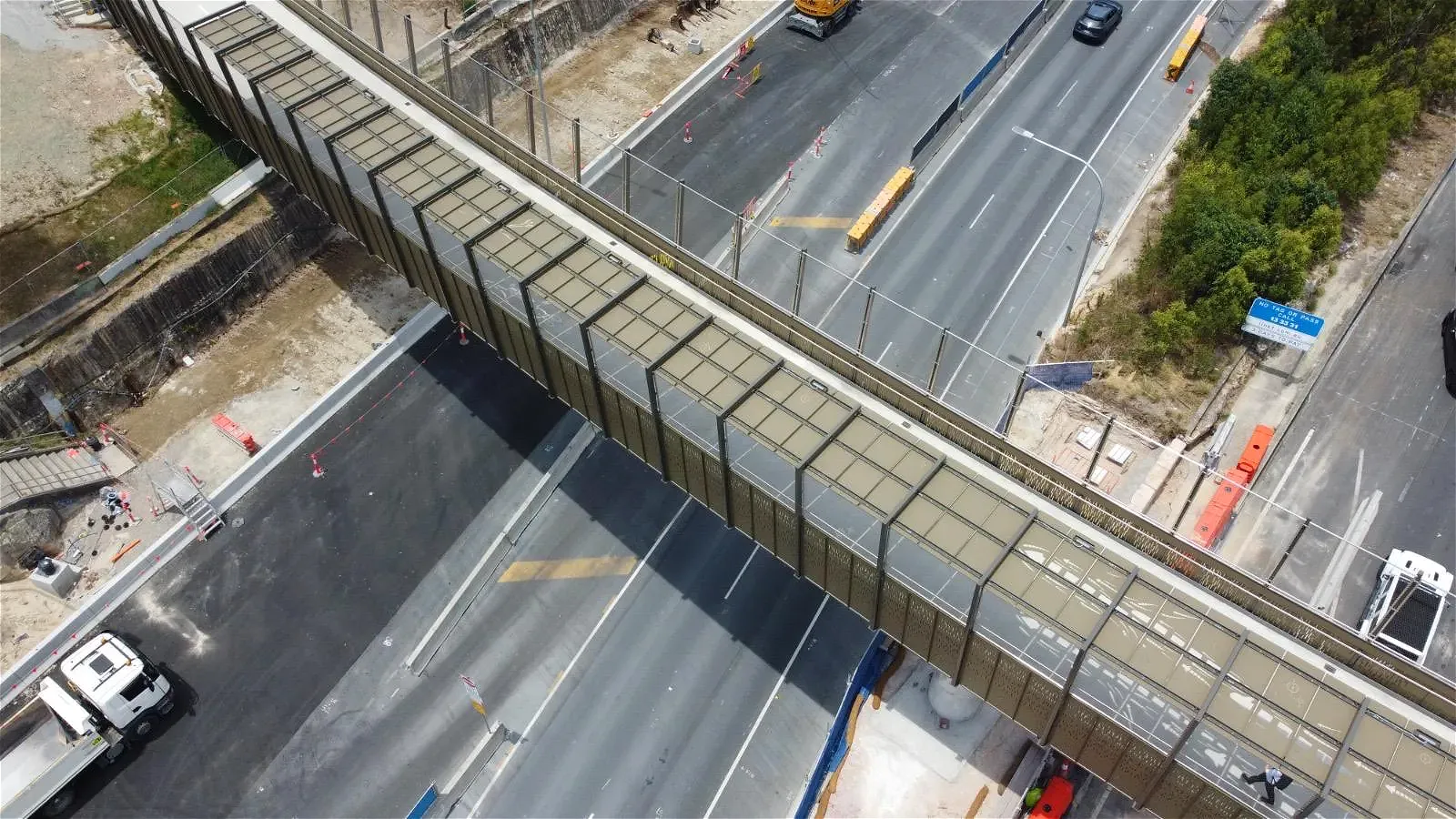 Overhead view of elevated pedestrian bridge over highway