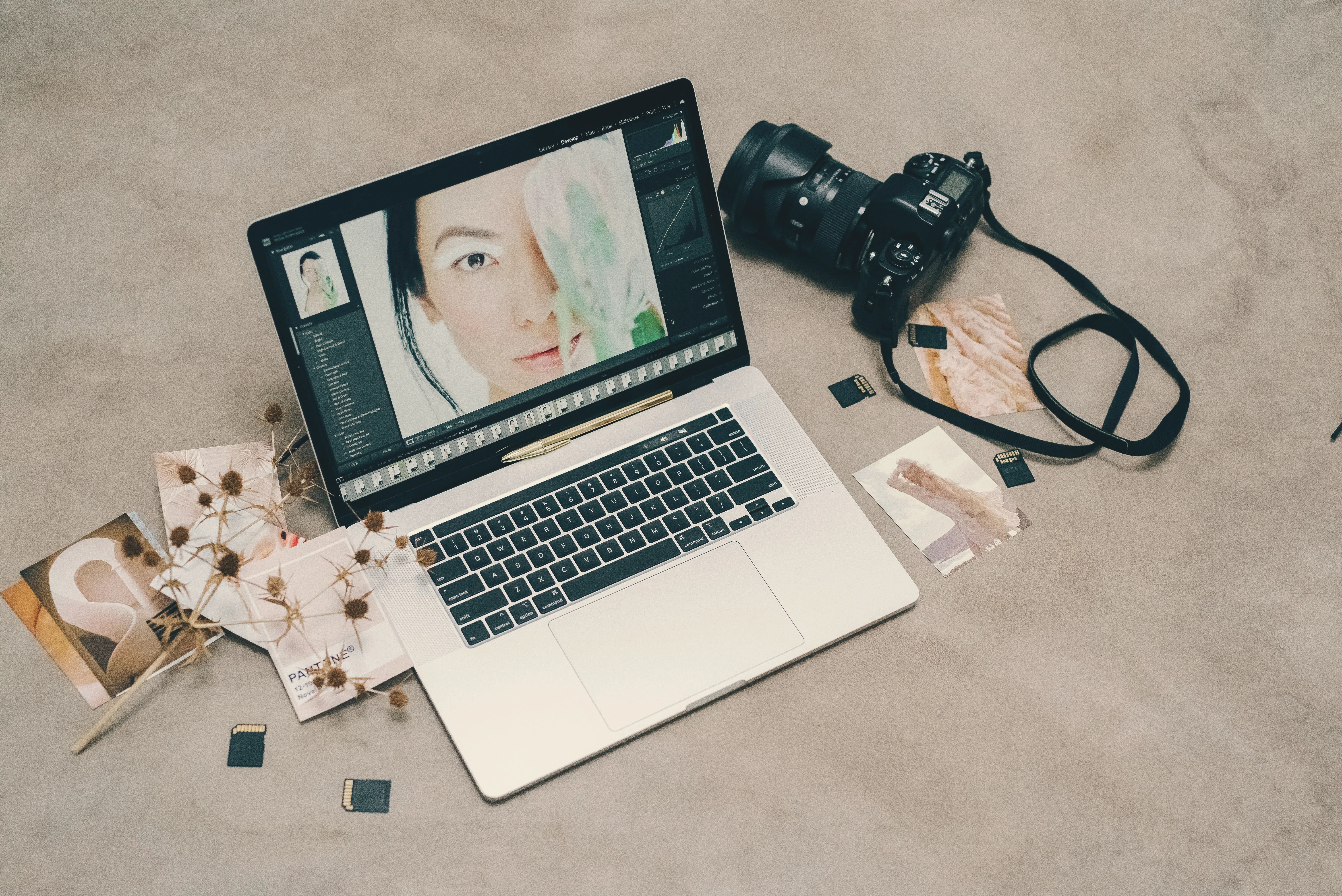 Laptop with camera and photo editing on screen