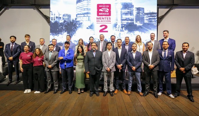 Group photo of program participants and mentors standing together at an accelerator event.
