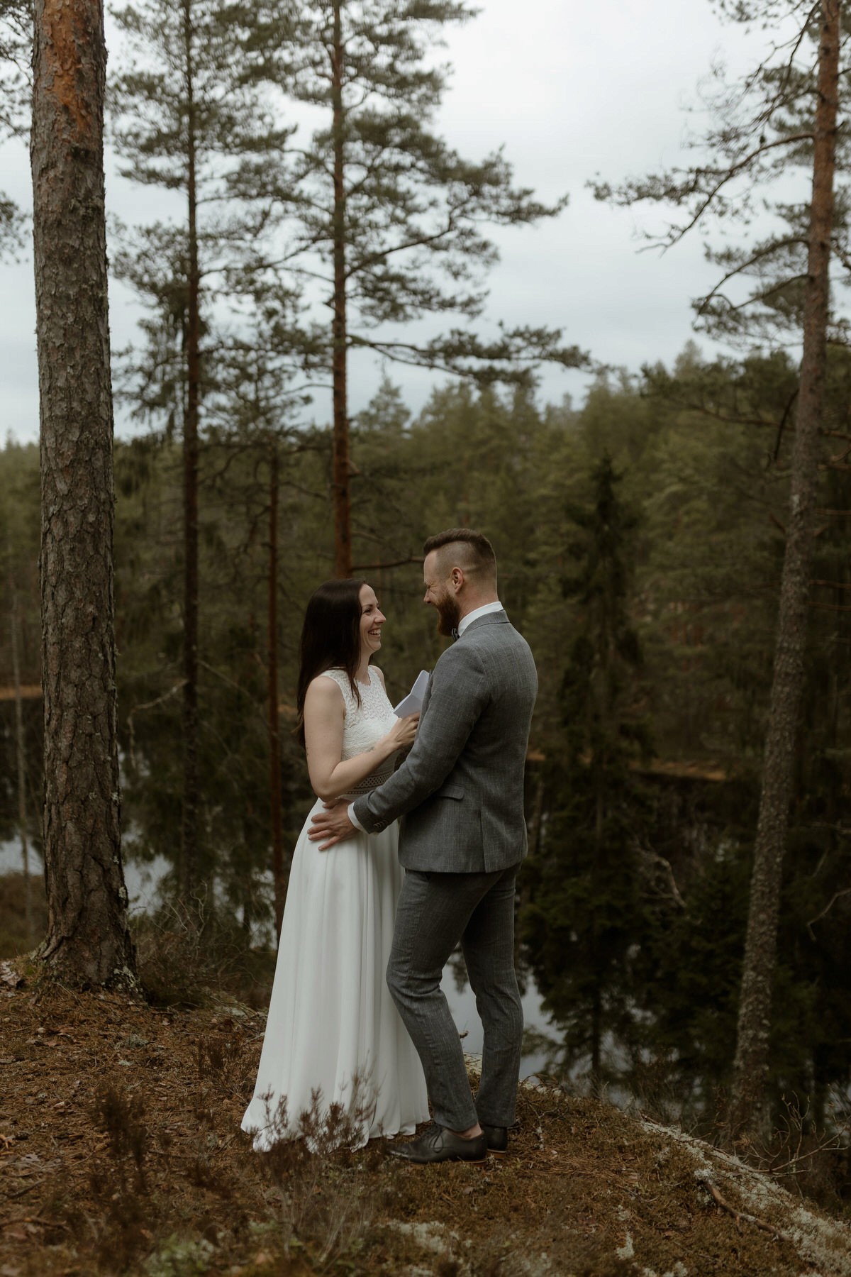 Couple saying vows in swedish forest