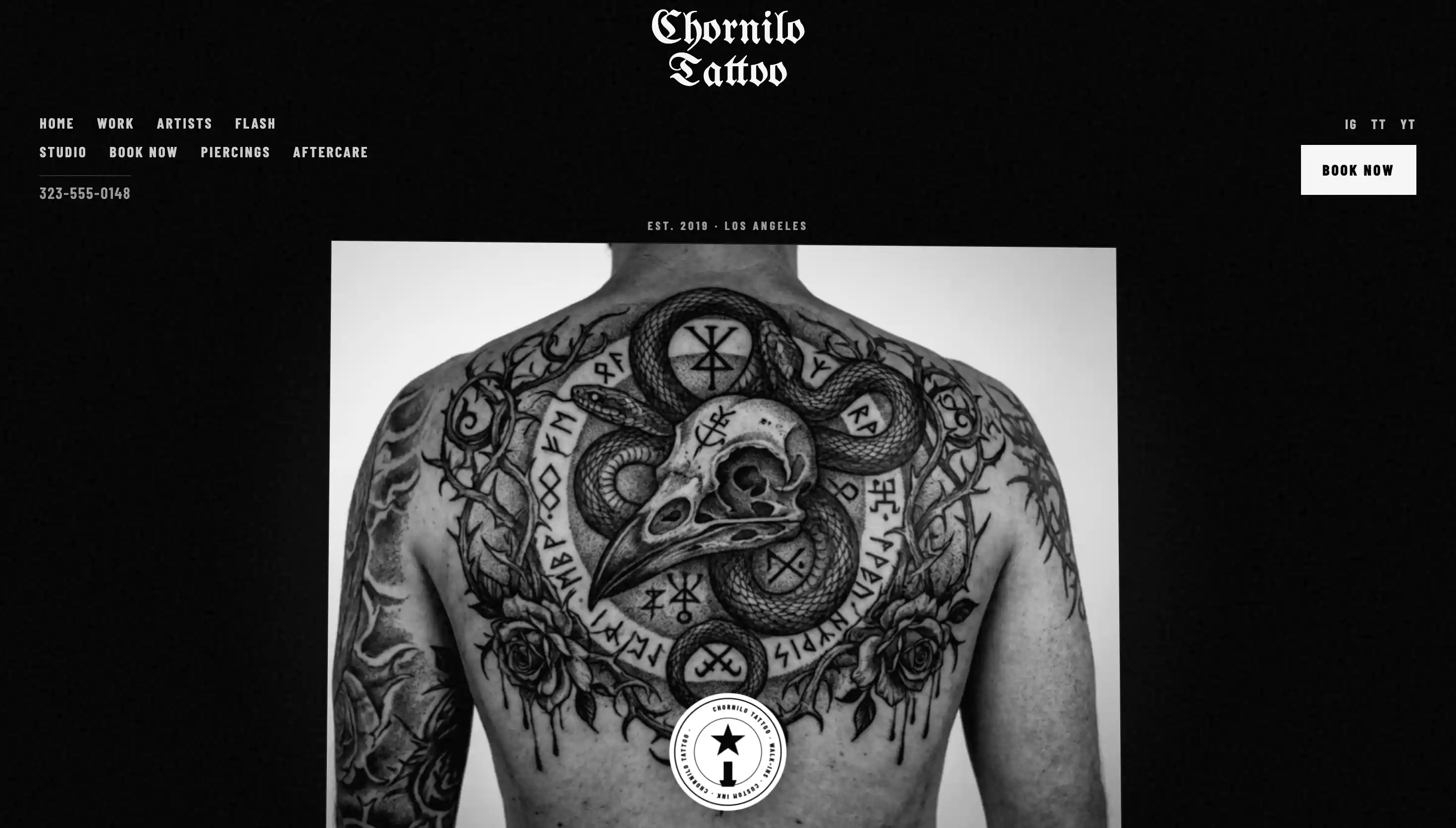 Homepage of a Los Angeles tattoo studio website featuring a detailed blackwork back piece