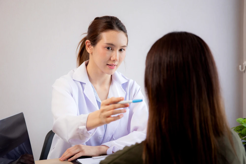 A doctor consulting a patient about Botox treatment.