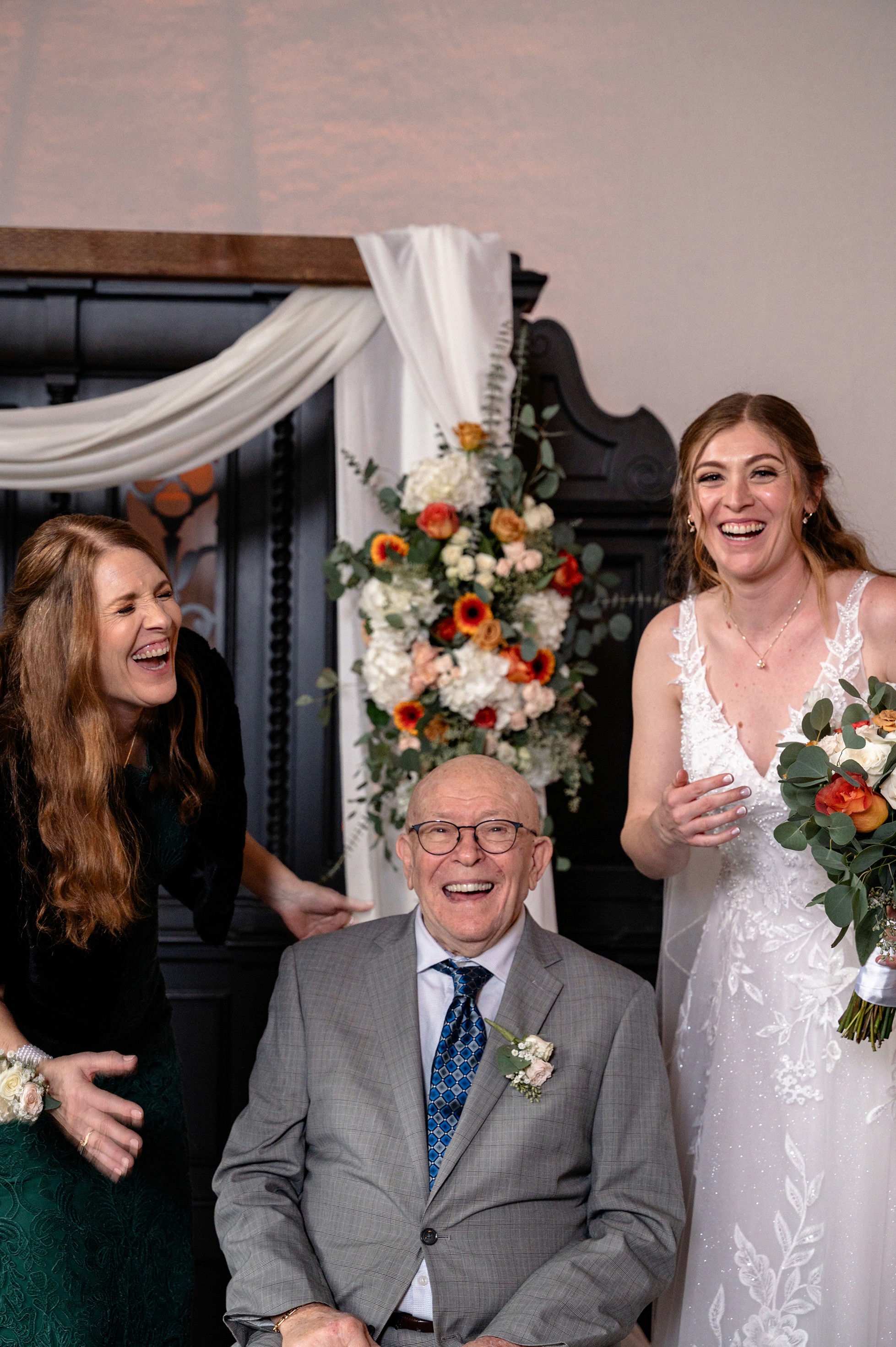 Flat lay wedding details with bouquet, rings, and sparkling bridal heels