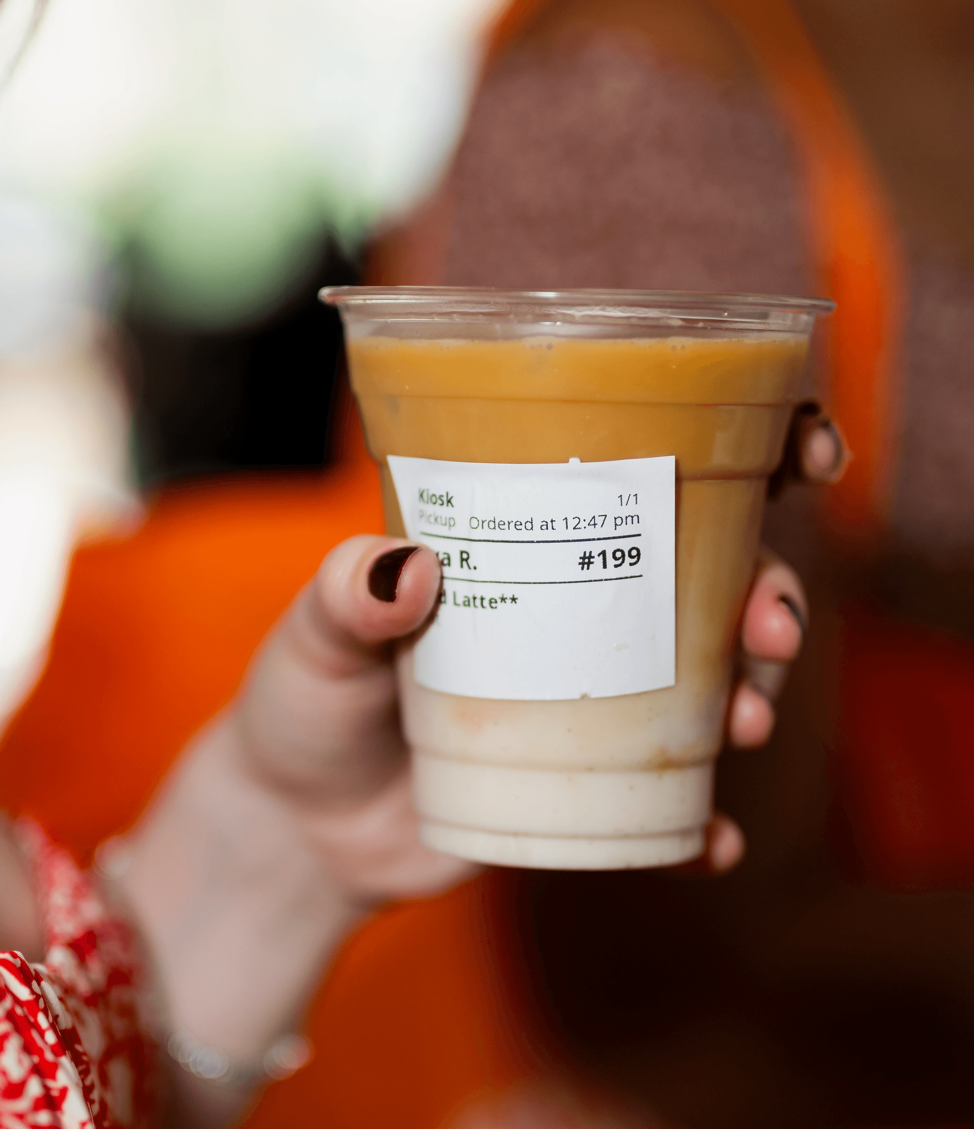 Coffee drink with Snackpass order sticky label