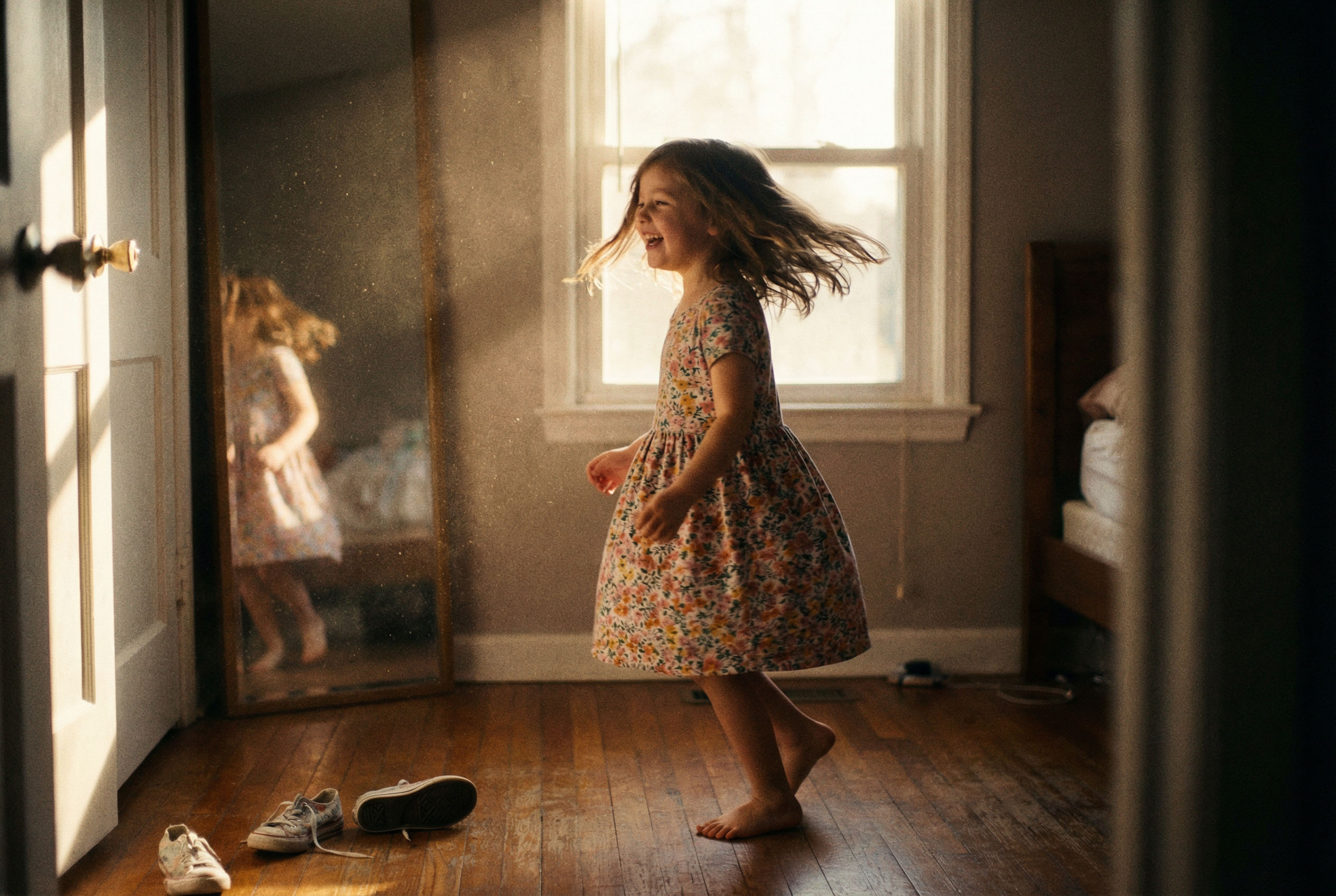 Three women holding hands at outdoor event