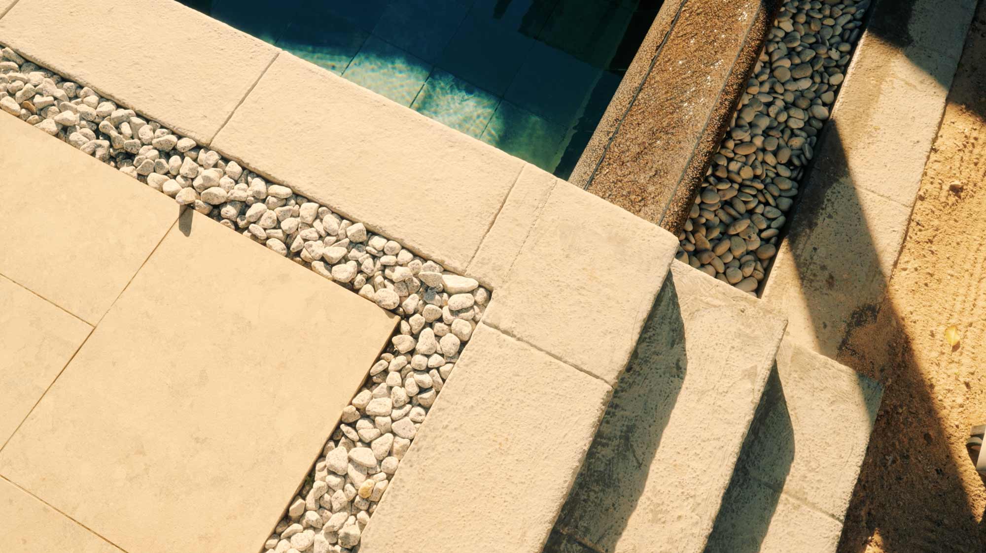 Sunny stone and pebble pathway; filmproduction ad for a hotel in mauritius