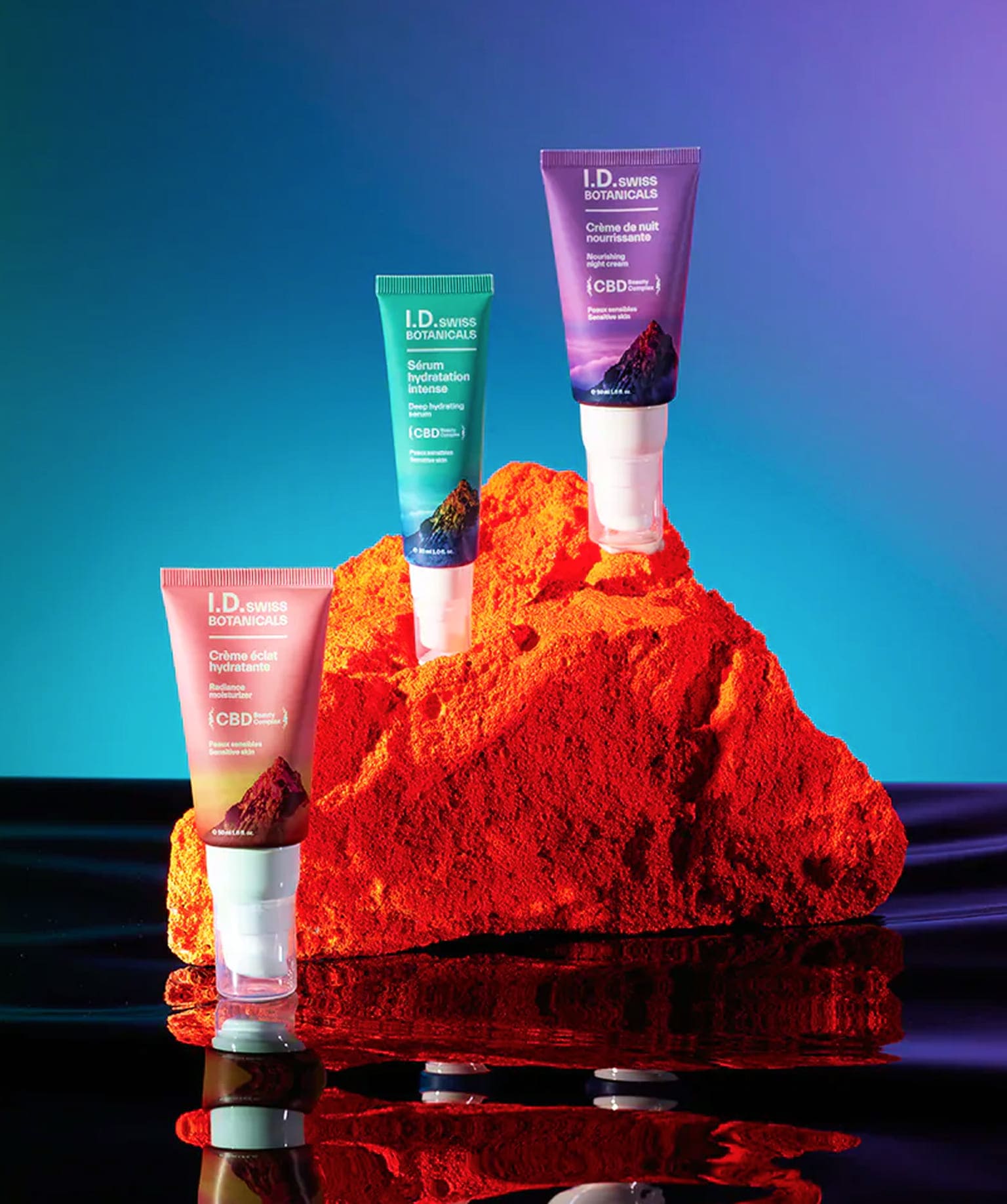 I.D. Swiss Botanicals premium CBD skincare products showcased in a vibrant campaign composition with bold colors and high-end cosmetic packaging