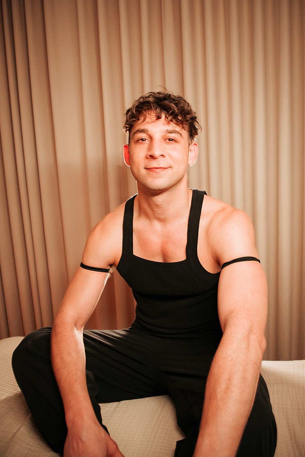 Portrait of David, who offers sugar waxing services.