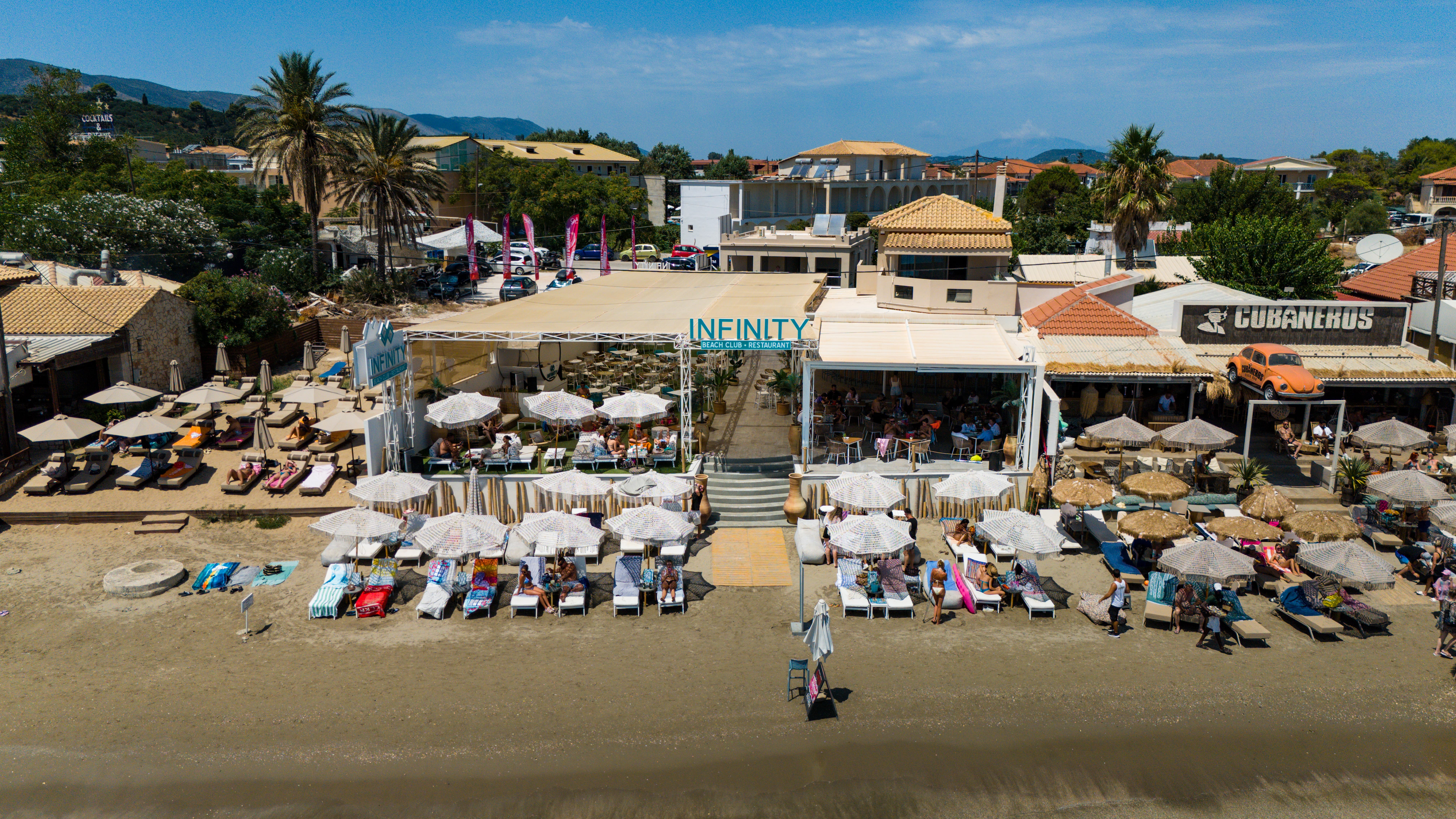 a woman in a dress sitting on a couch