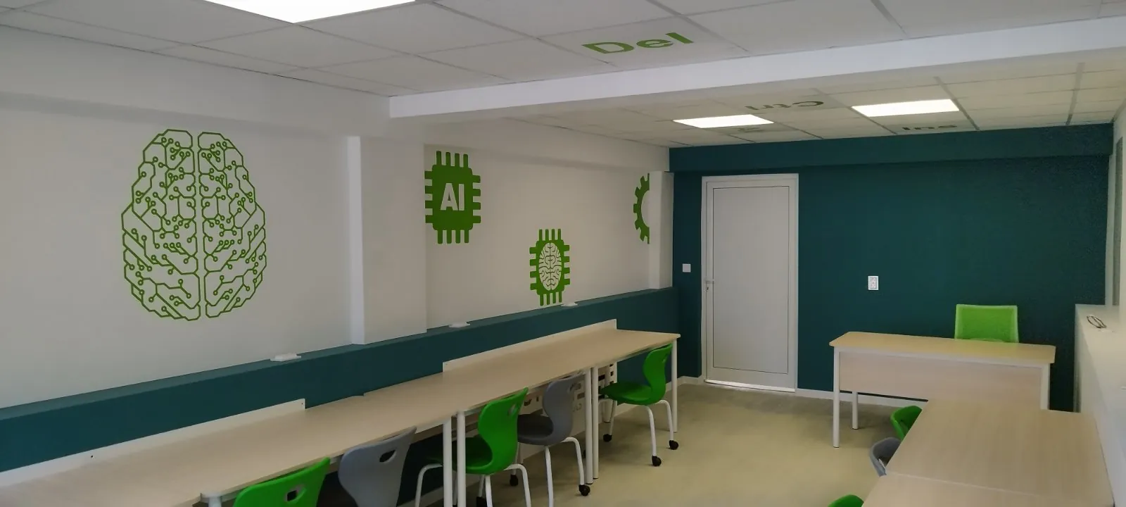 Modern classroom with green school chairs, tables, and AI-themed wall graphics